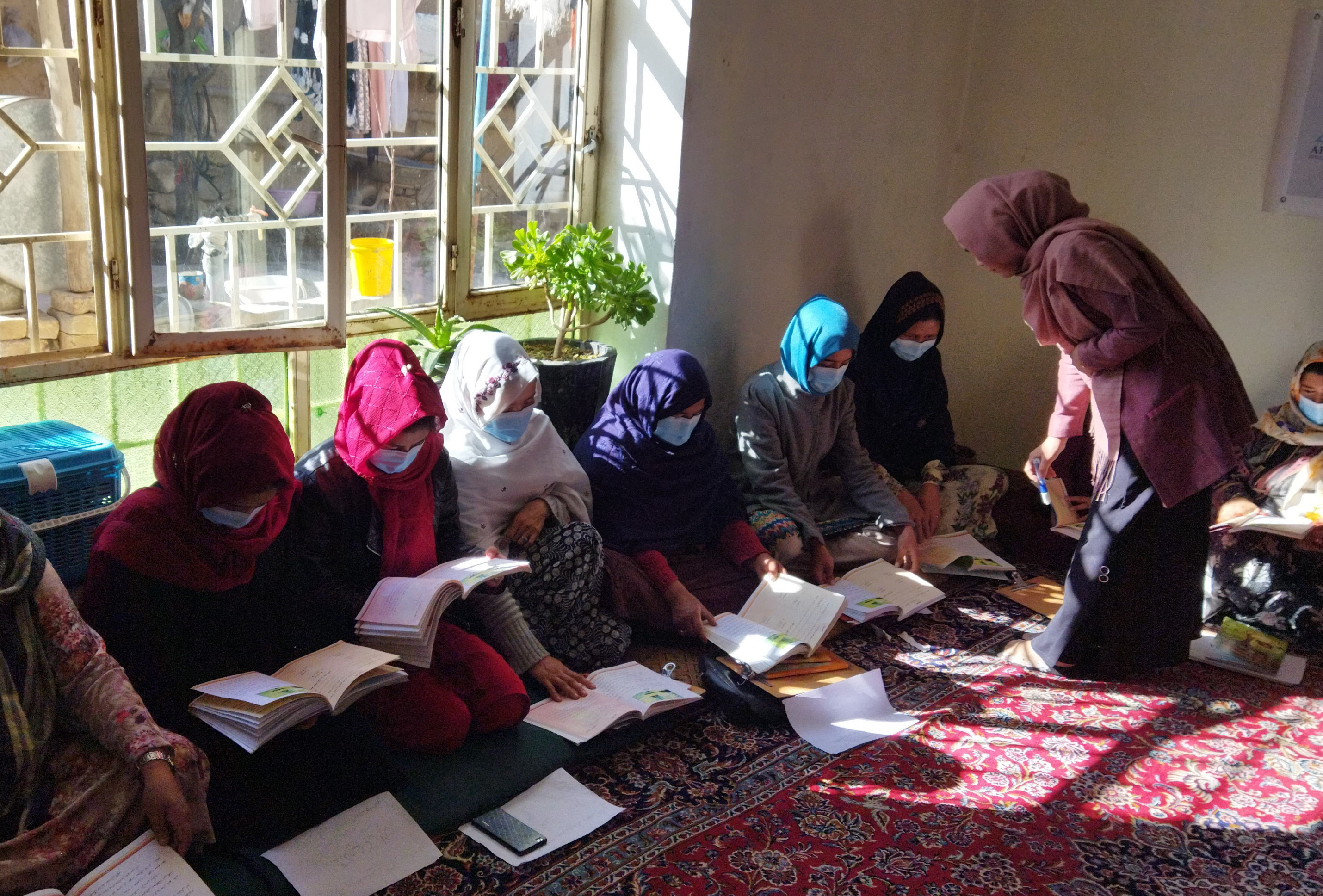 Women learning in a school in Afghanistan
