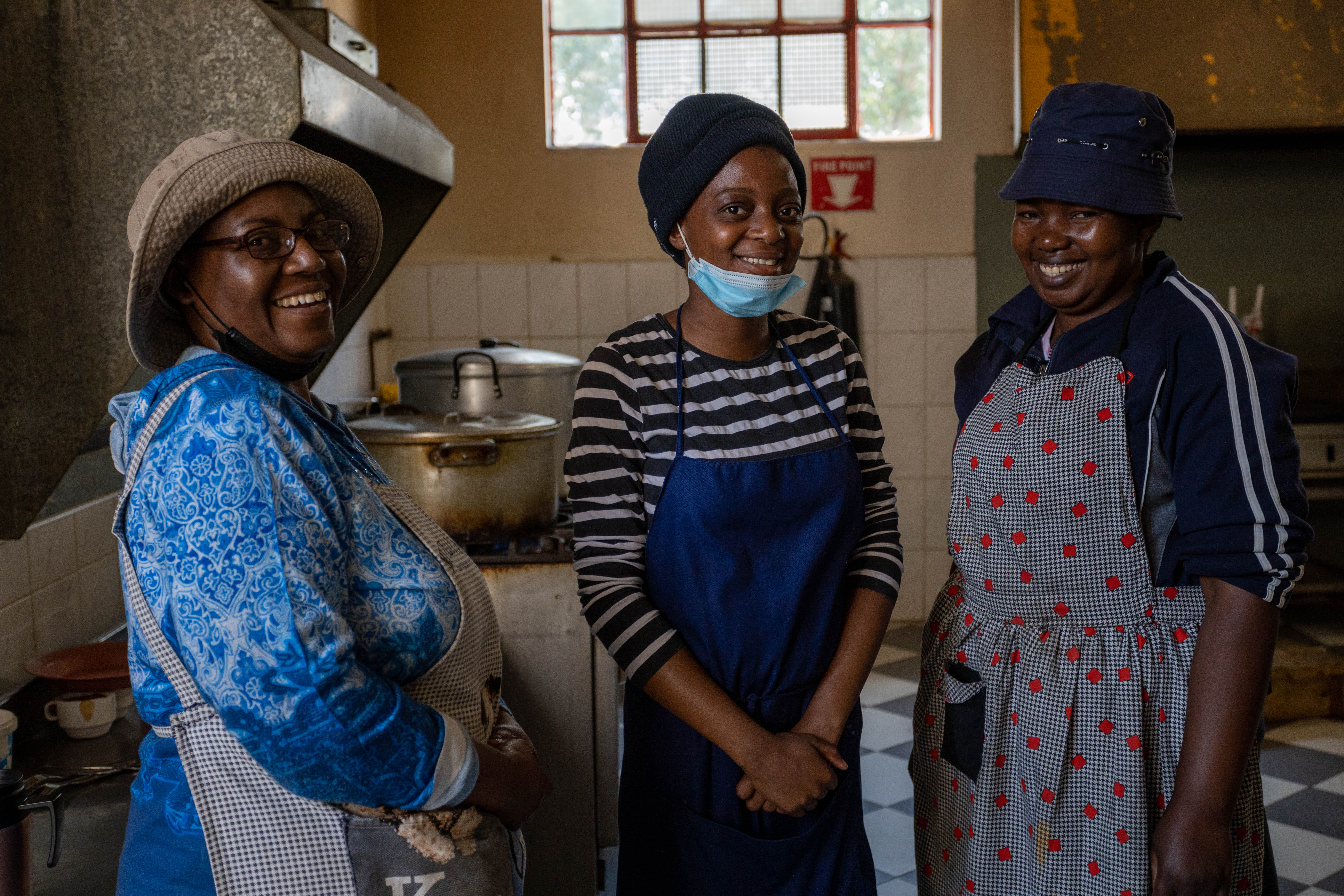 From left to right: Loreen Bafana, Samantha Saeau and Lumbai Mleya. These three help cook and serve meals for the people at the Sandra Jones Centre in Zimbabwe.