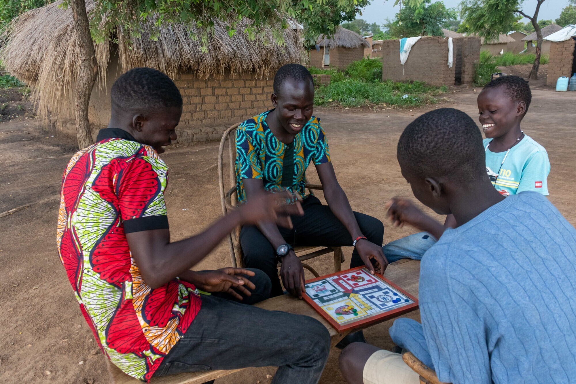 Bidali Augustine playing ludo with his siblings.