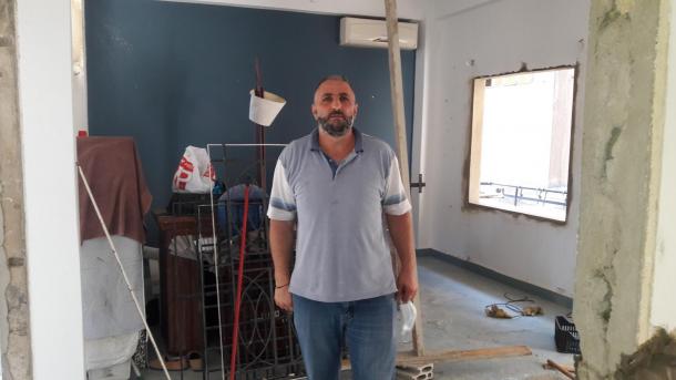 With the reconstruction nearly complete, Hafez Sammour stands in his home that suffered extreme damage from the Beirut blast.