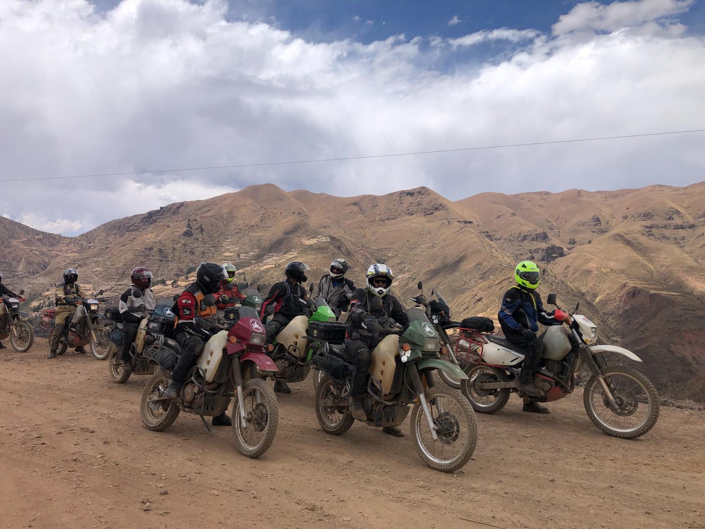 A large group of people on motorcycles in the mountains of Bolivia