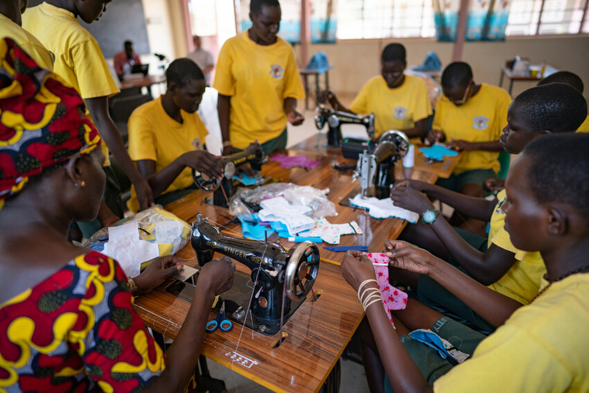 The sewing class at Loreto Rumbek School sew together the base units for reusable mentstral pads.