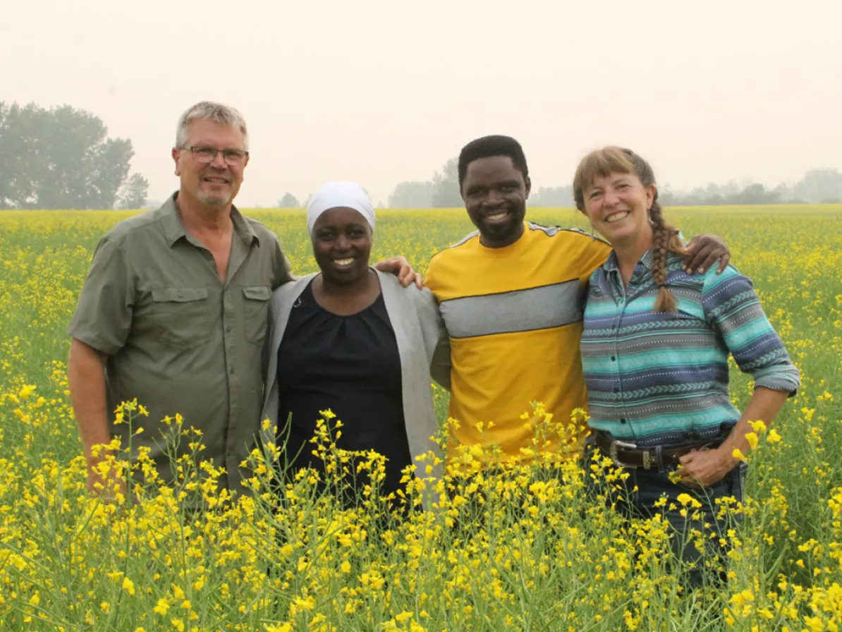 a group of four in a Grow Hope canola field