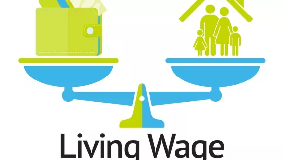 An illustration of scales with a wallet on one side and a family under a roof on the other. Underneath the scale it says, "Living wage"