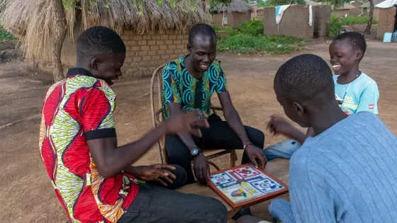 Bidali Augustine playing ludo with his siblings.
