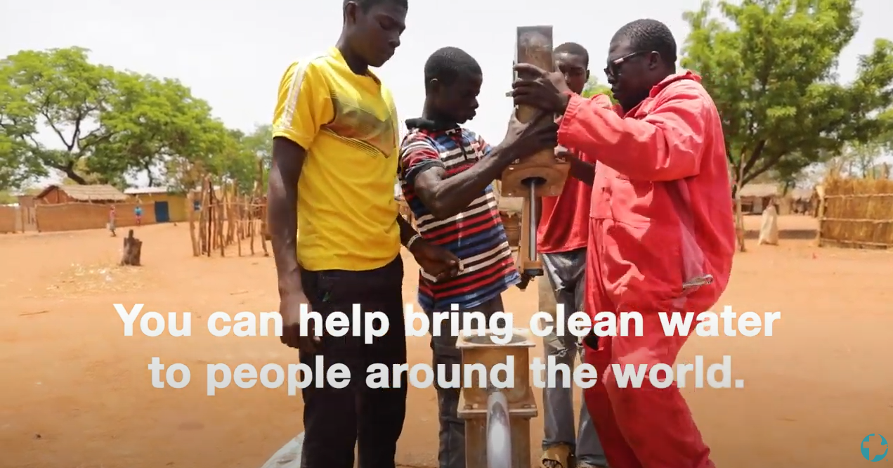 Four men install a well in Chad. Text on the screen says, "You can help bring clean water to people around the world."