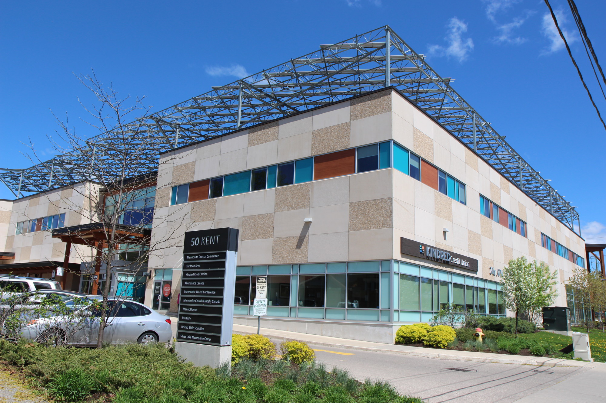 A city building with solar panels on the roof.