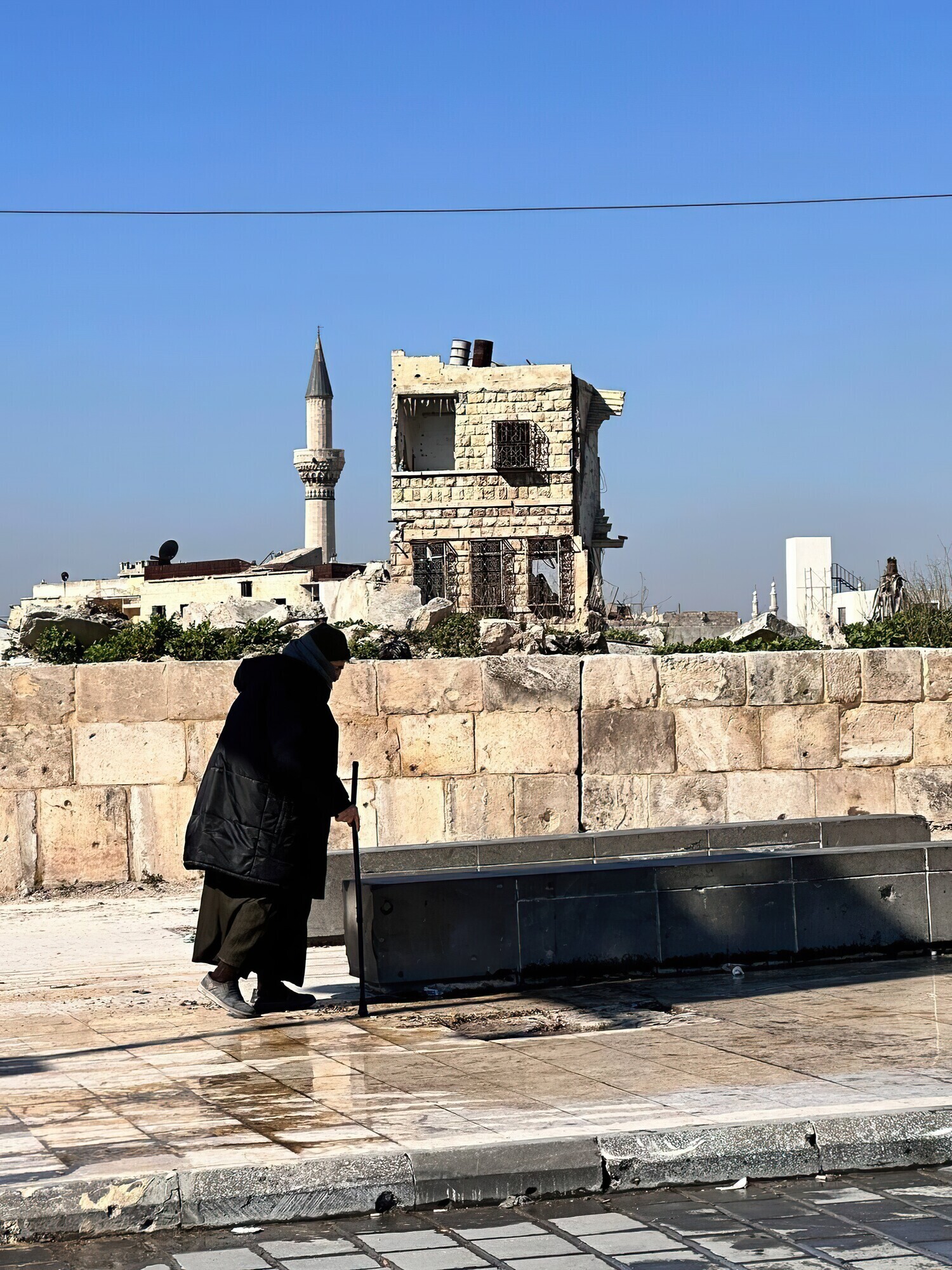 A woman walking in Aleppo