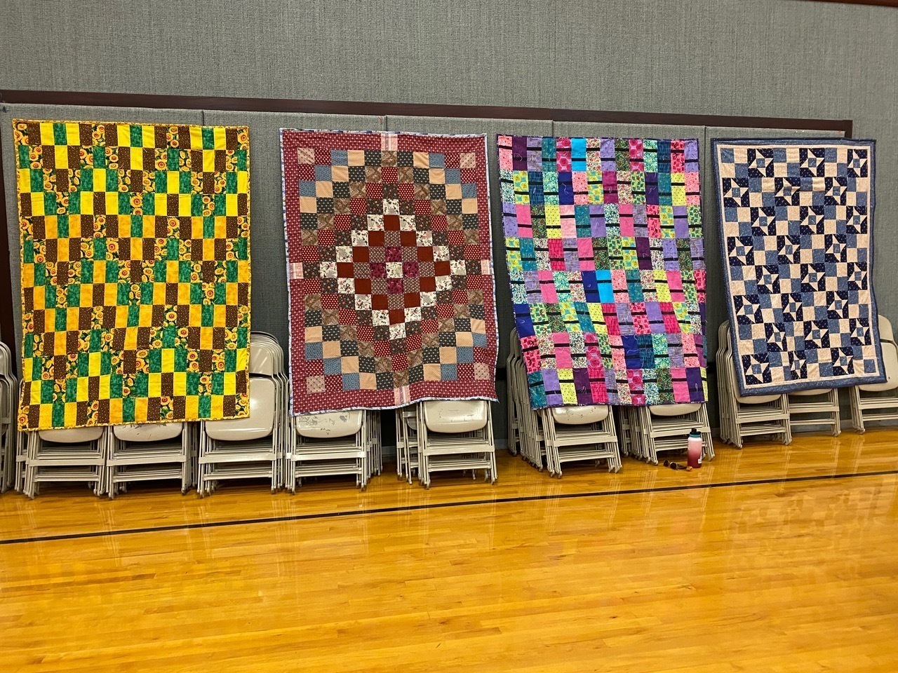 Quilts hanging on a wall