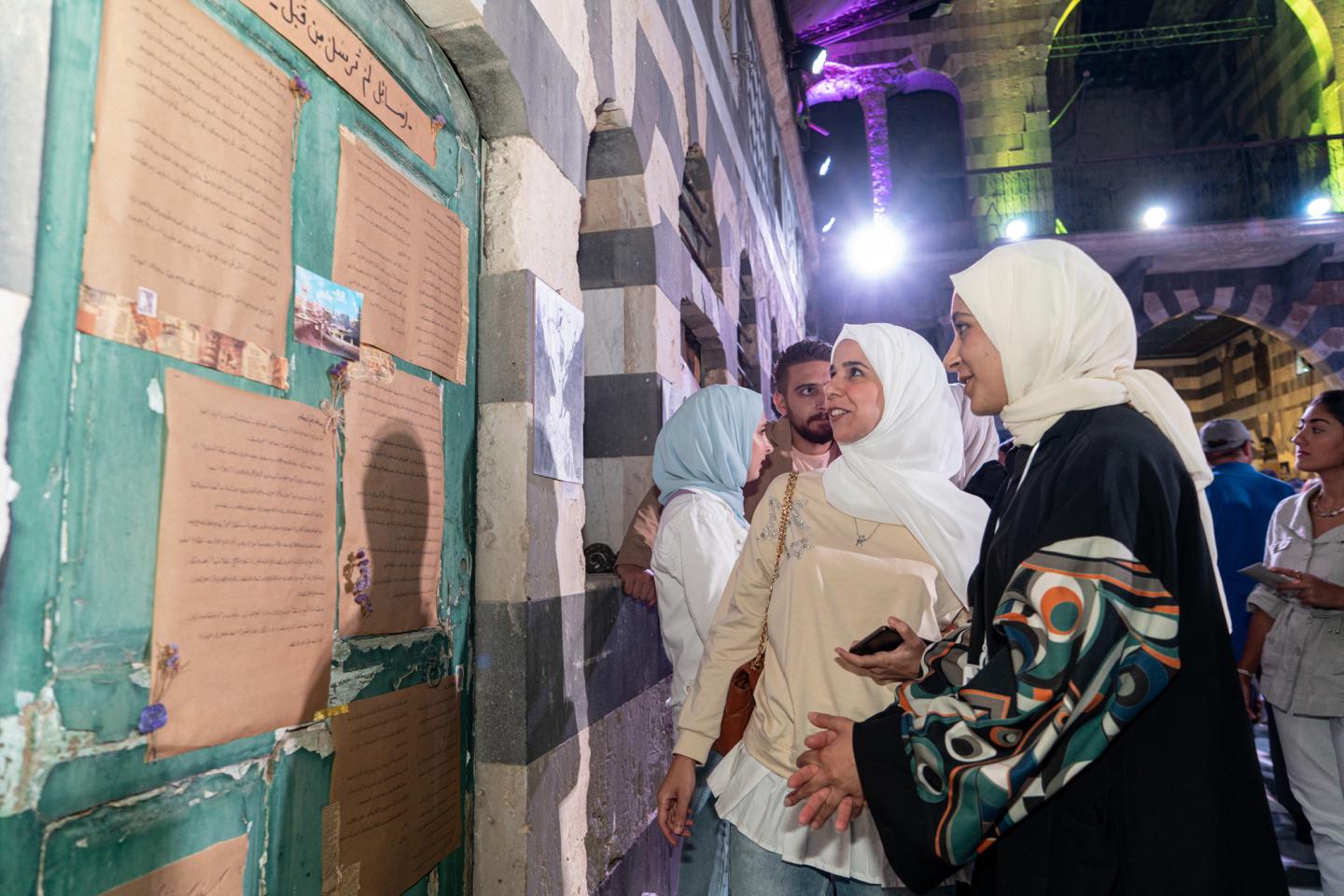 Two women looking at an art display