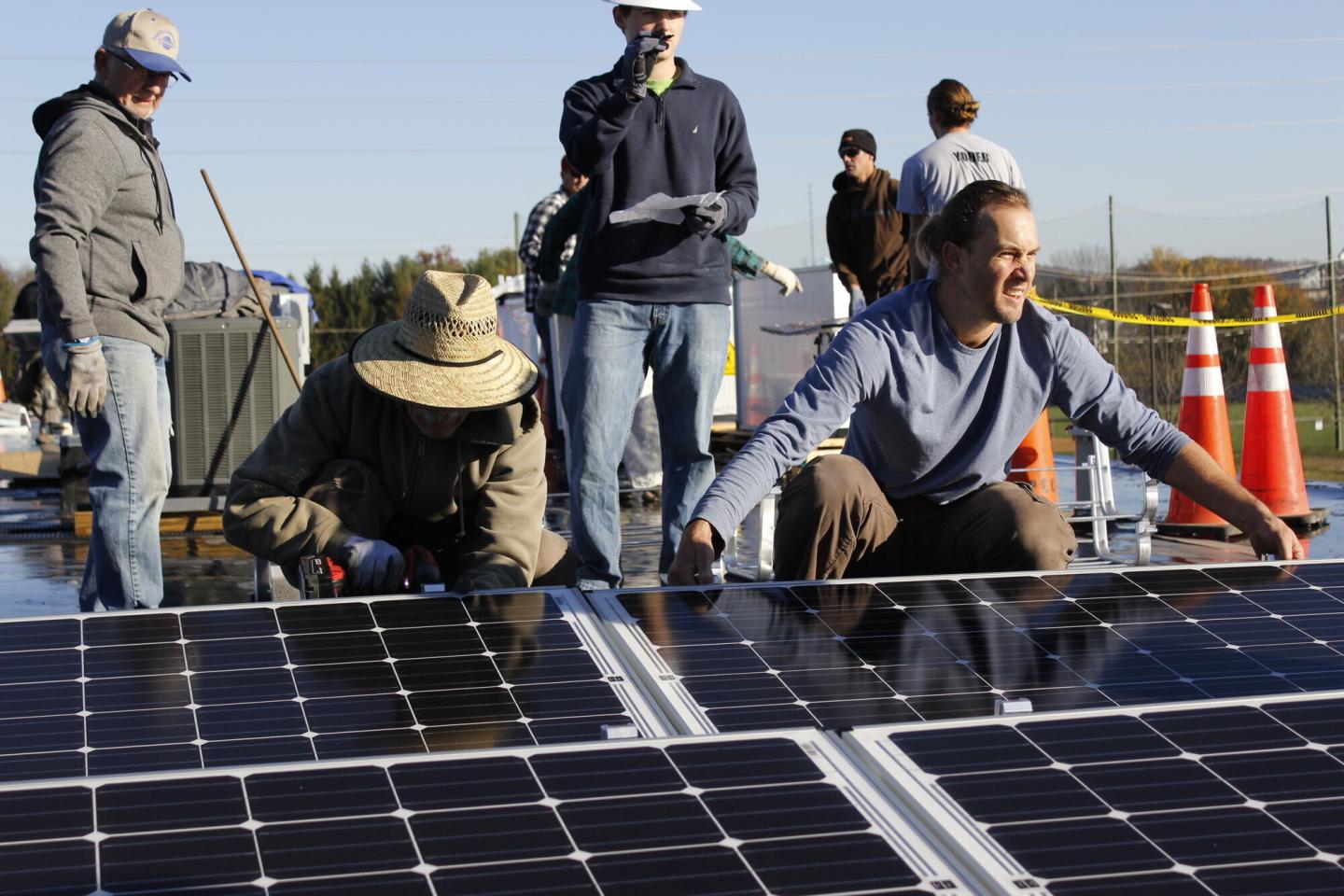 Volunteers installed 180 solar panels on the roof of Gift & Thrift, an MCC Thrift shop in Harrisonburg, Virginia, on November 19, 2016.