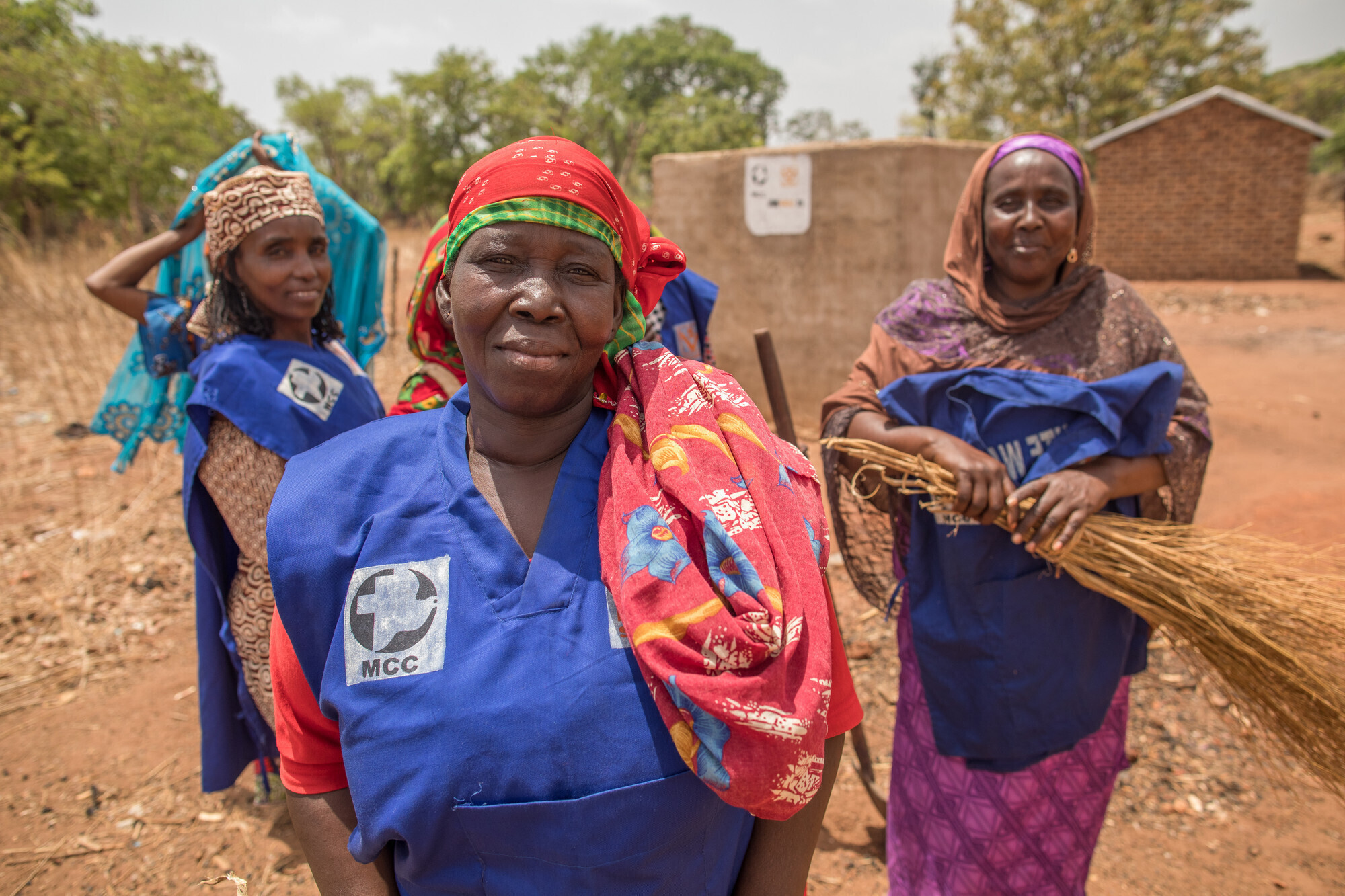 Three Chadian women in blue vests