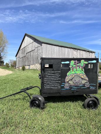 An Amish buggy that has been painted with a mural