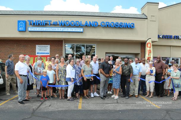 Judy Miller (center) cuts the ribbon at the Grand Opening of Thrift at Woodland Crossing on August 18, 2022. Miller is the manager of the thrift shop located in south-central Elkhart, Indiana.