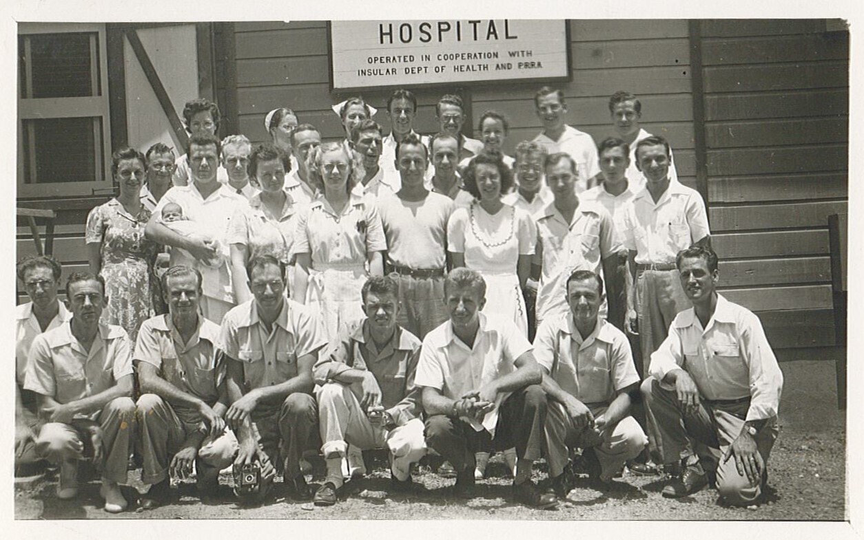 a group of people in the 1940s in front of a clinic in puerto rico