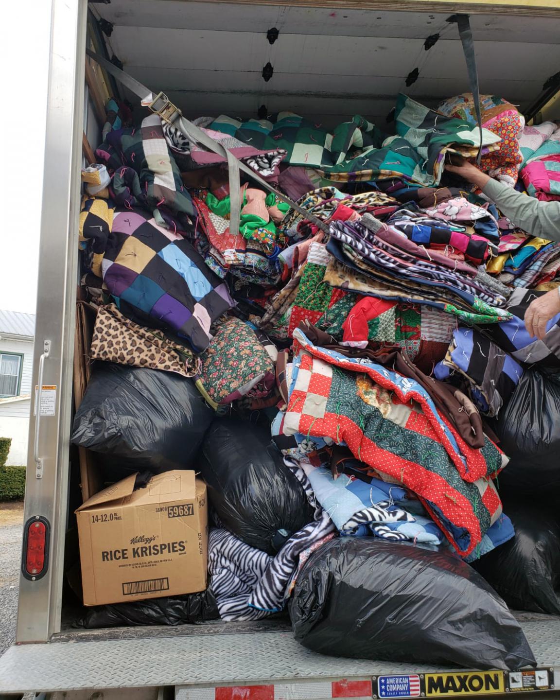 A trailer truck full of comforters.