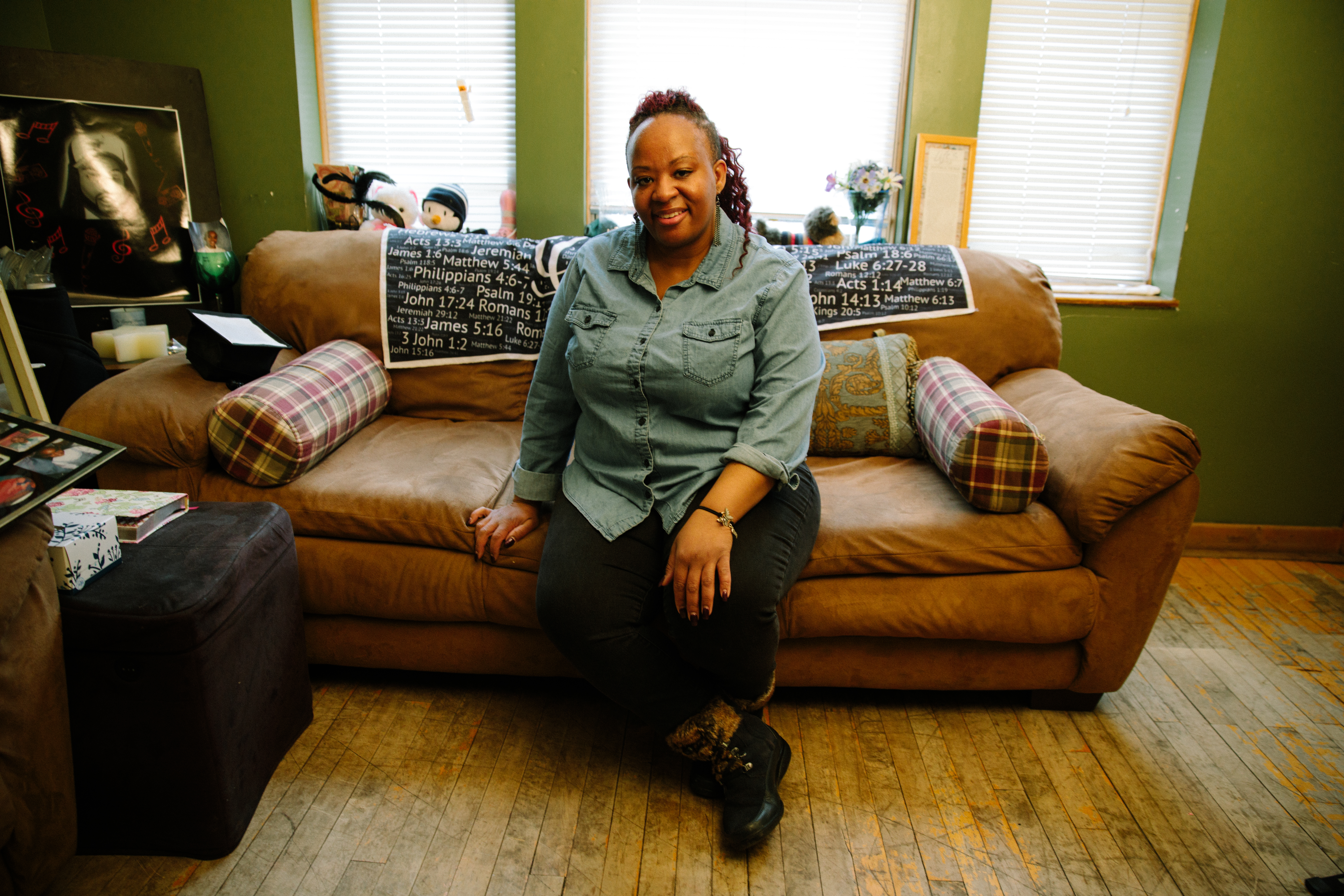 A woman sits on a couch