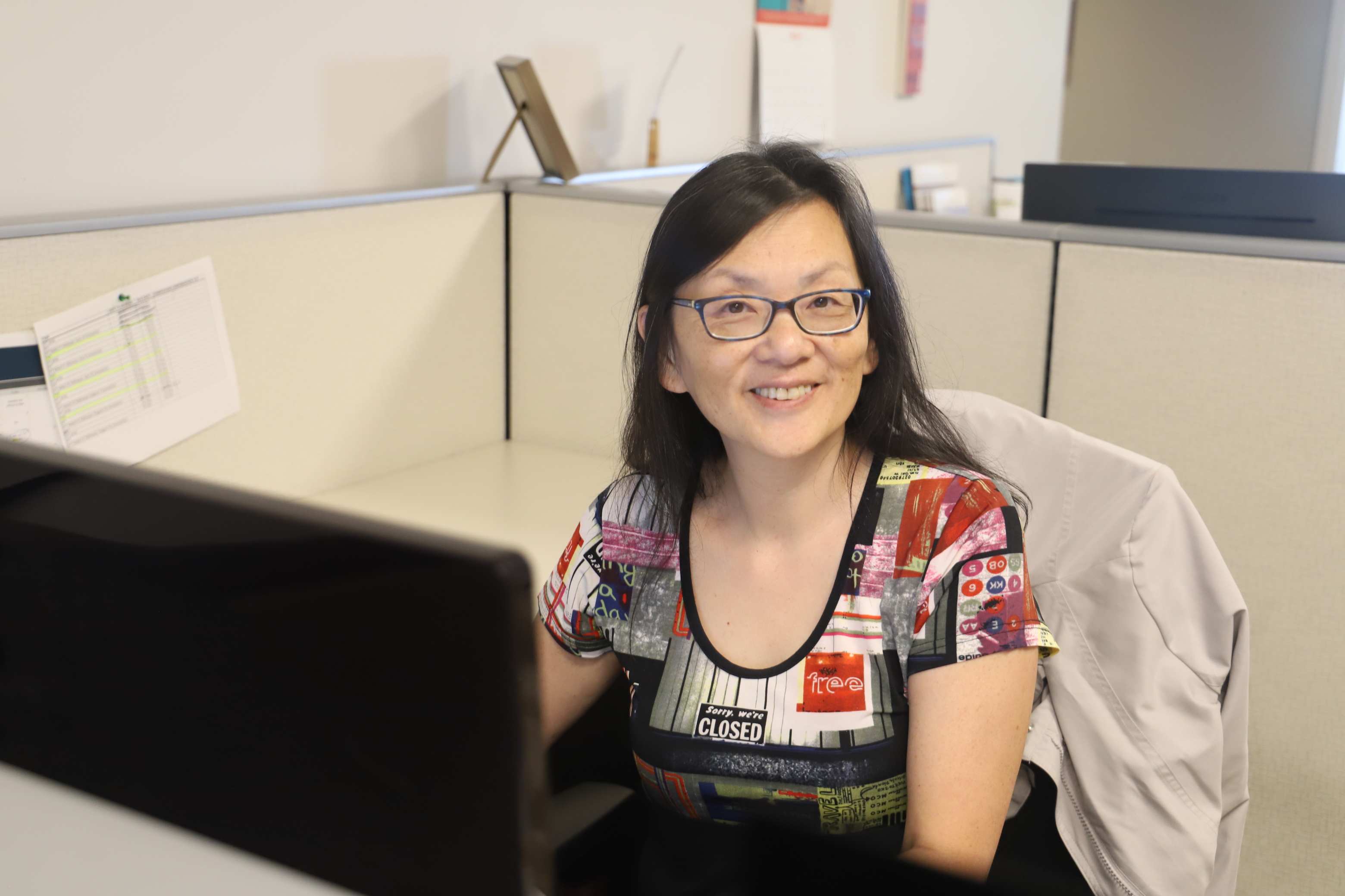 A woman sitting at a desk