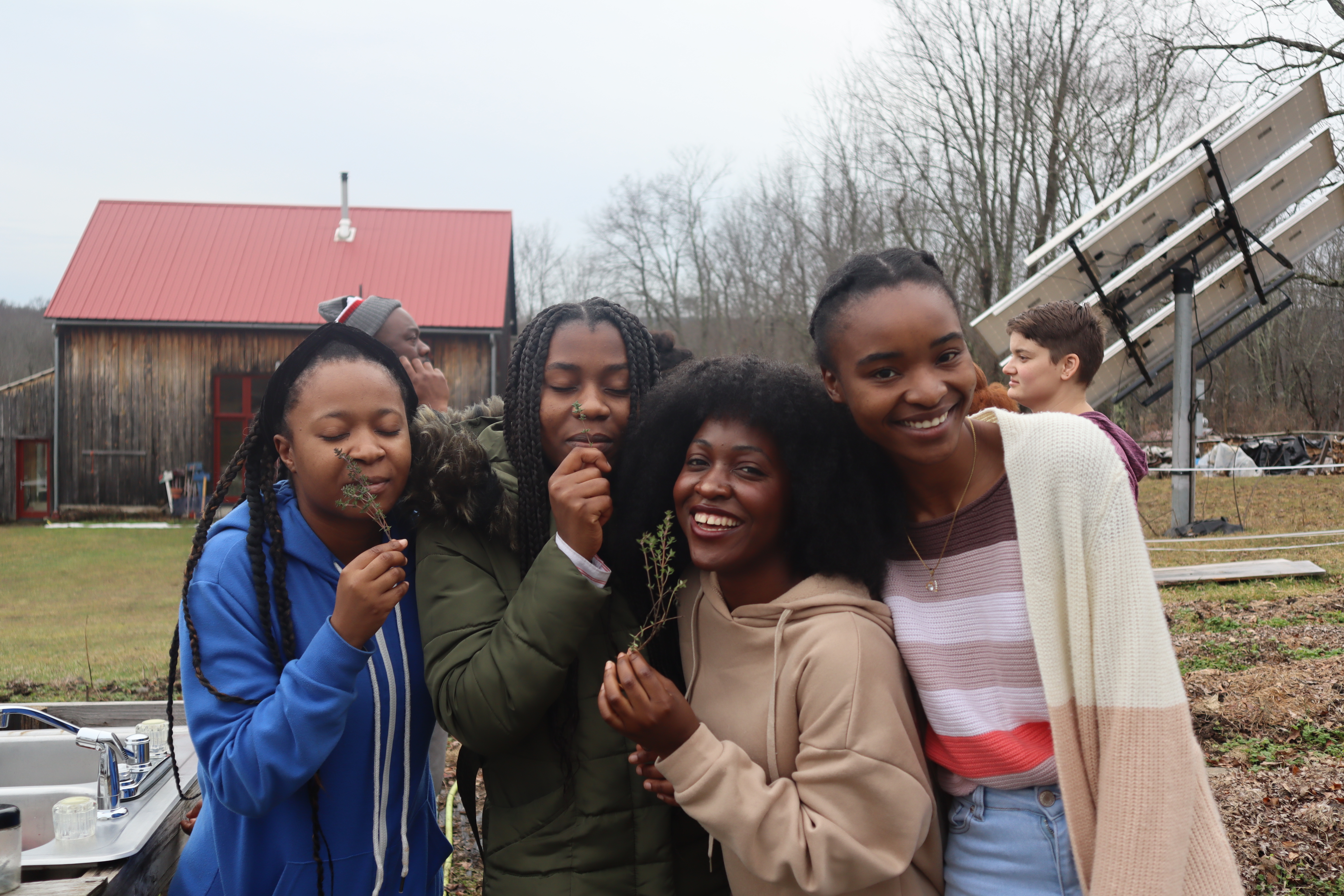 People smelling herbs.