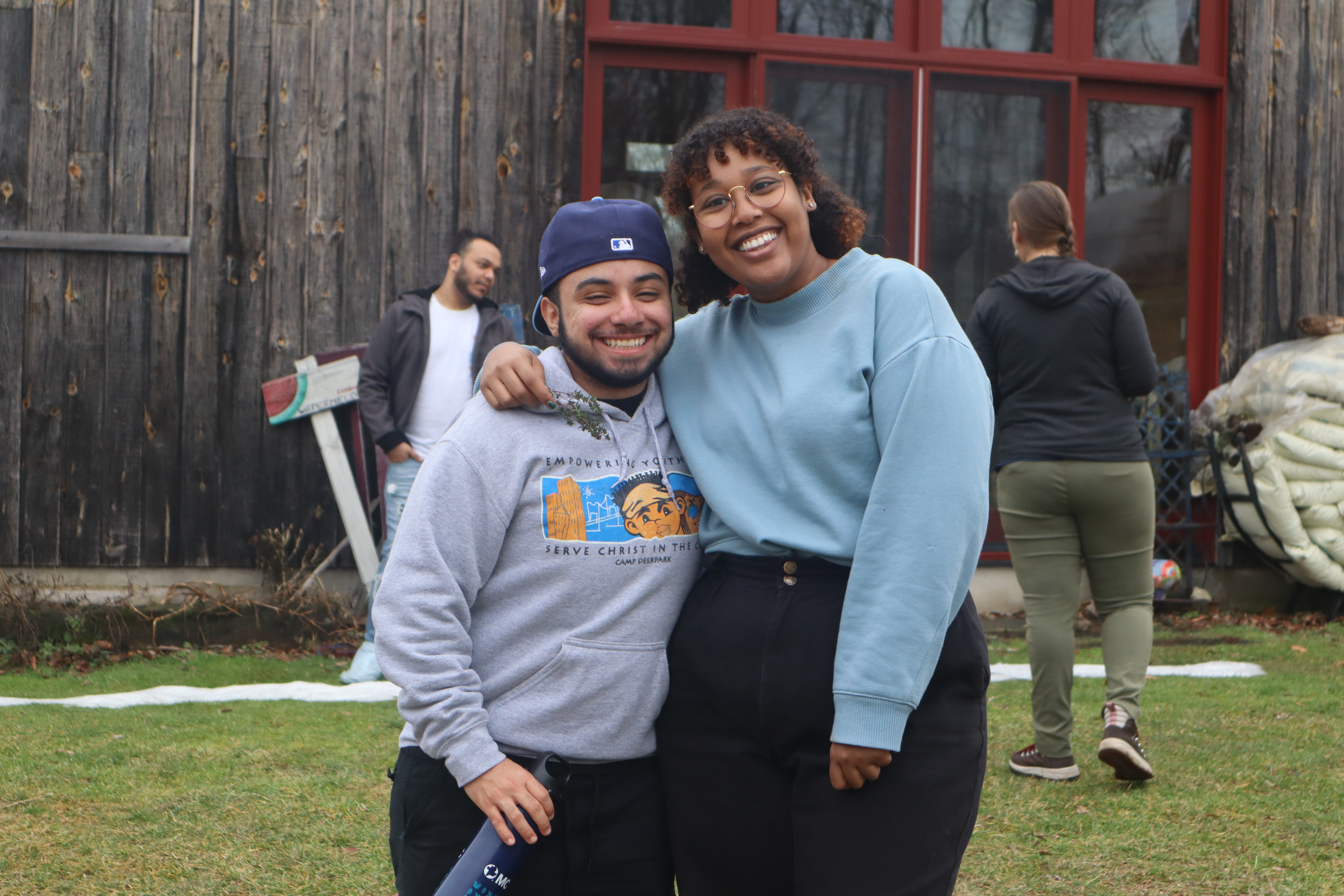 Two people smile at the camera. 