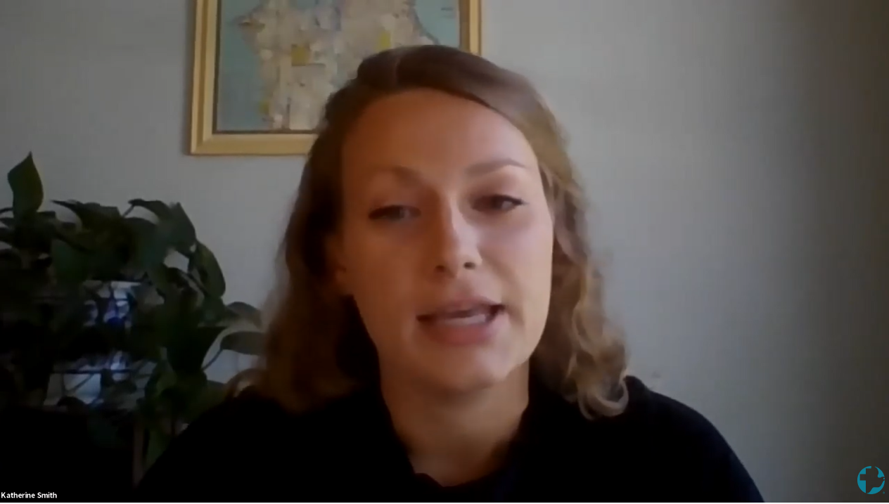 A young woman speaking during a webinar zoom call