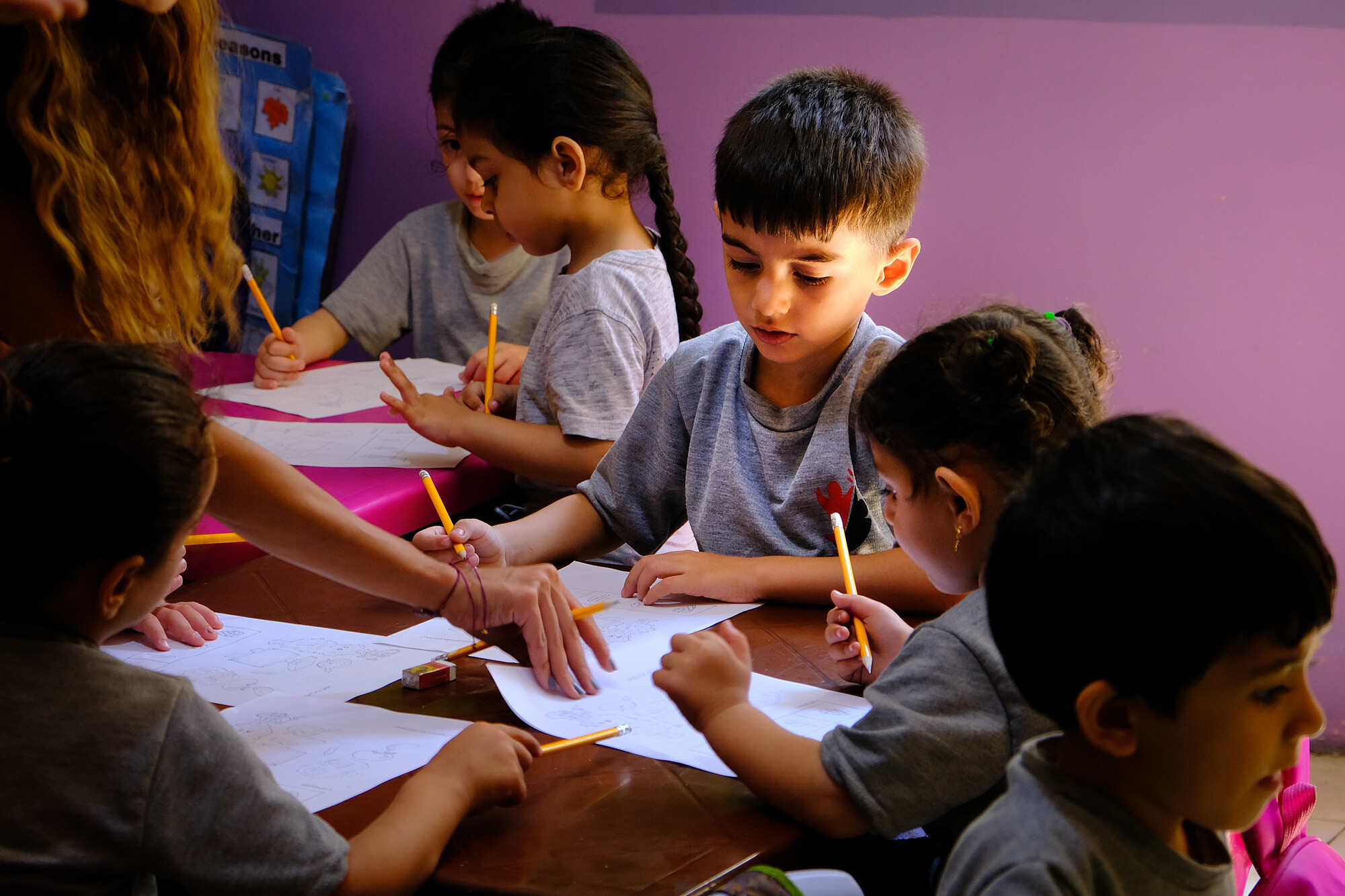 Children complete their final exams in a kindergarten class in Lebanon.