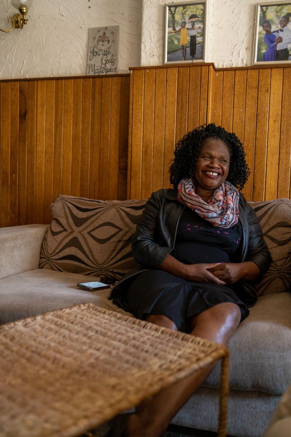 A Zimbabwean woman sitting on a couch
