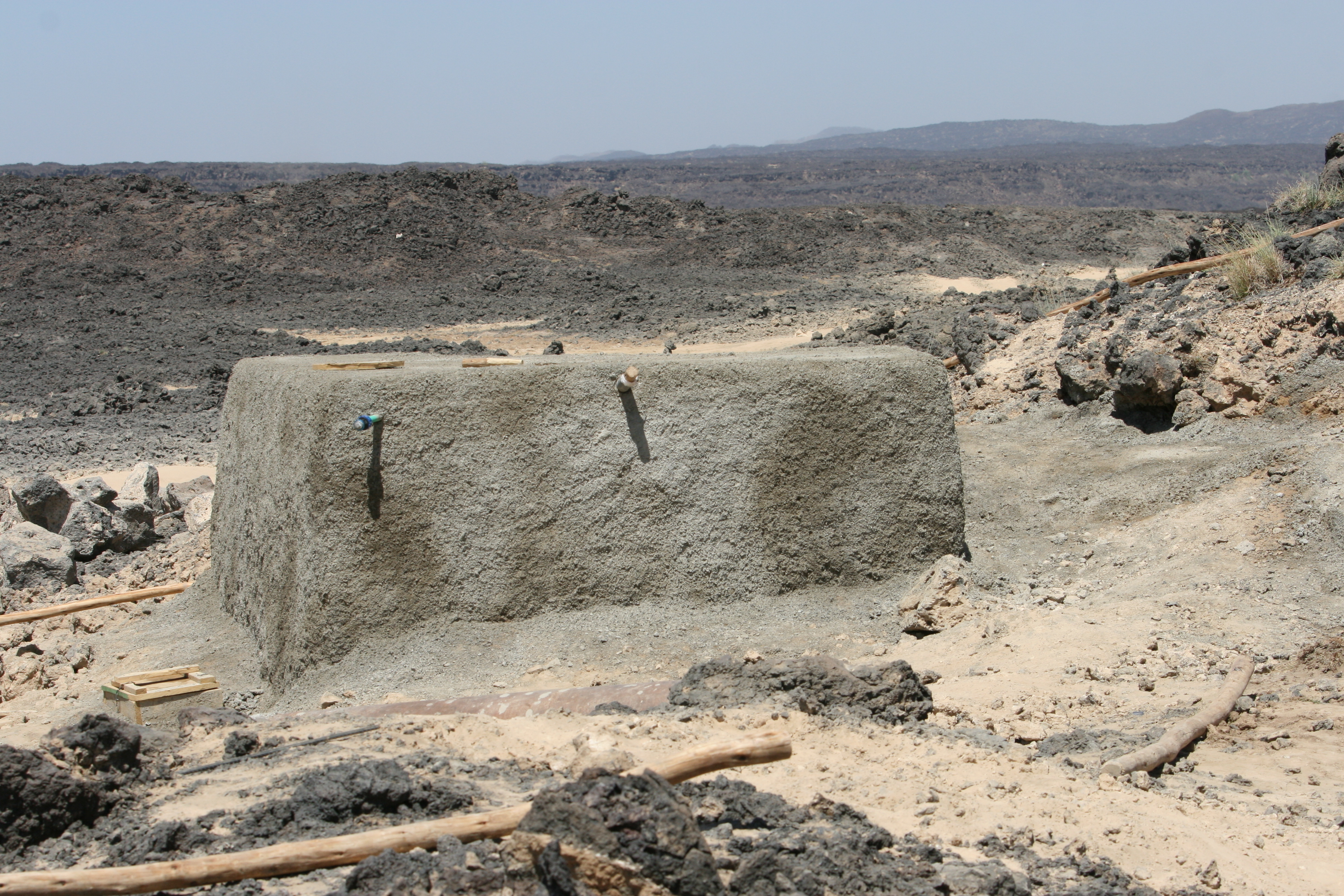 A large cement looking block in the middle of the desert in Ethiopia