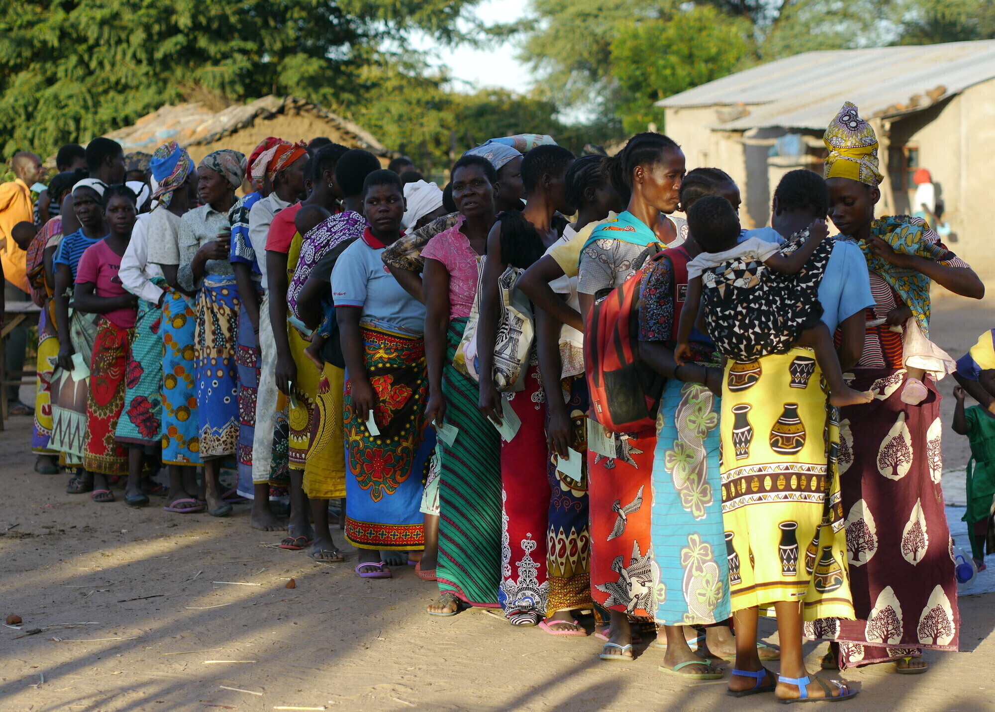 A group of Malawi women wait in a line