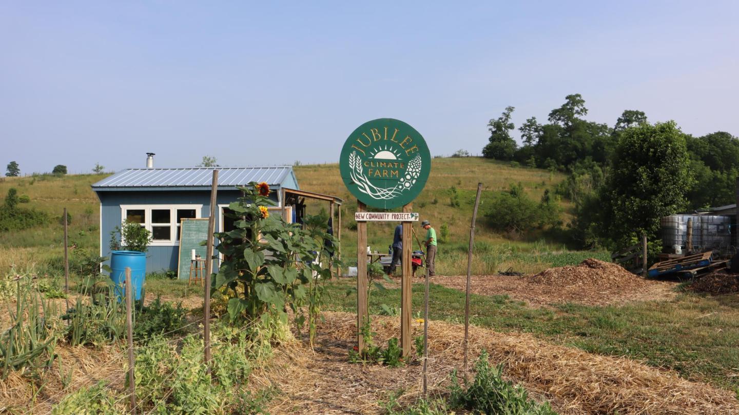 A sign at a farm that read "Jubilee climate farm"