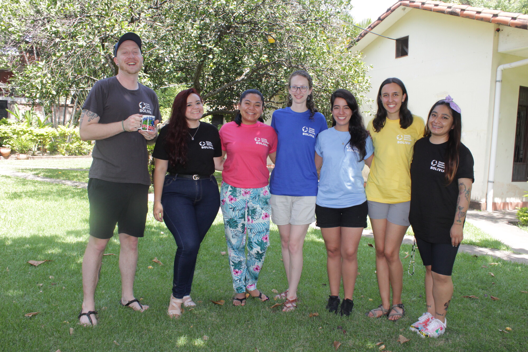 A group of young adults pose for a photo