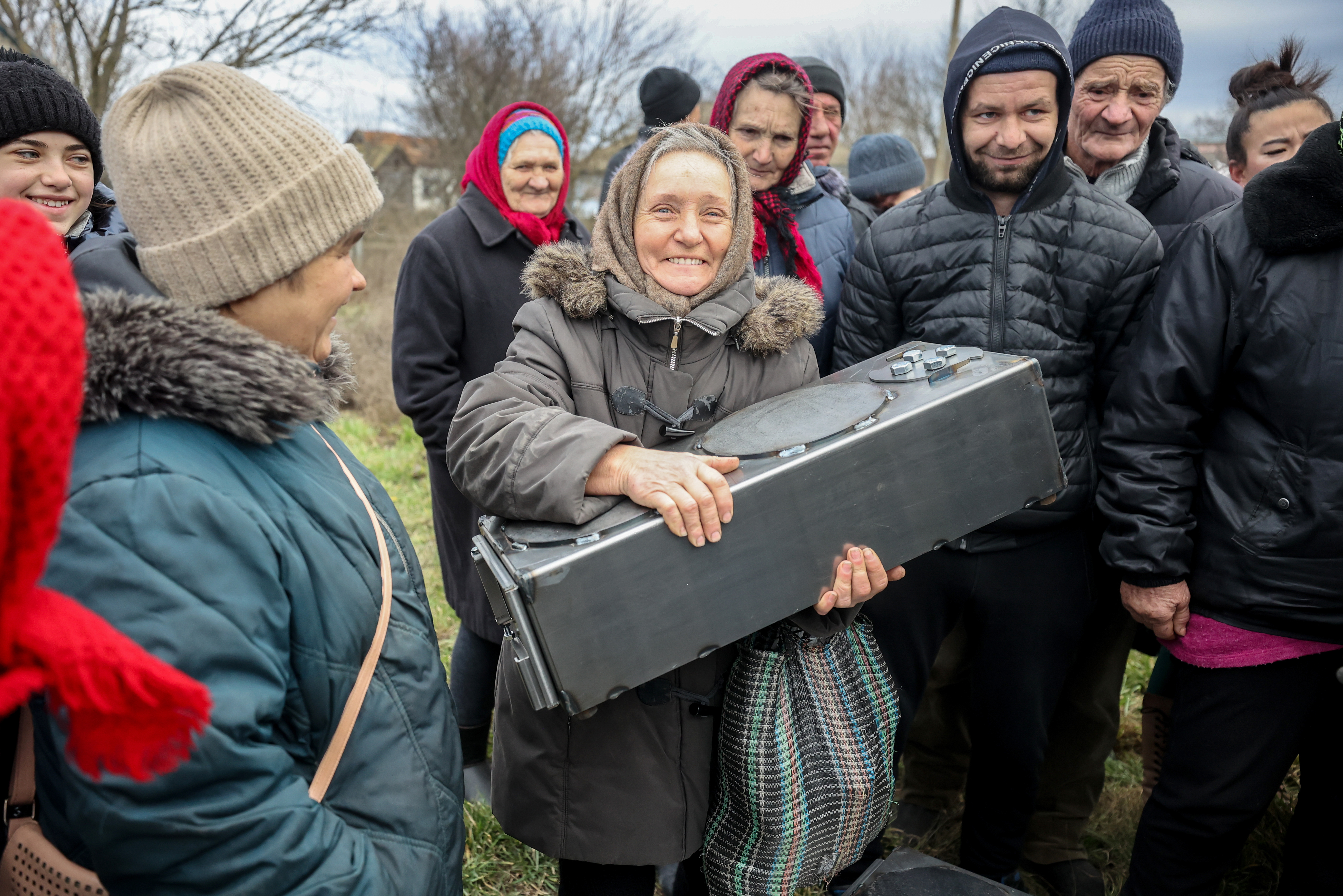 A woman receiving an MCC relief kit