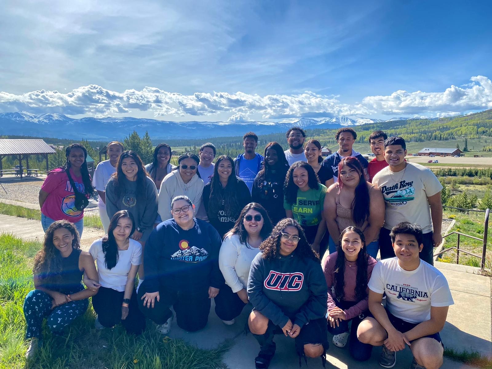 group of young adults outside in front of mountains Colorado