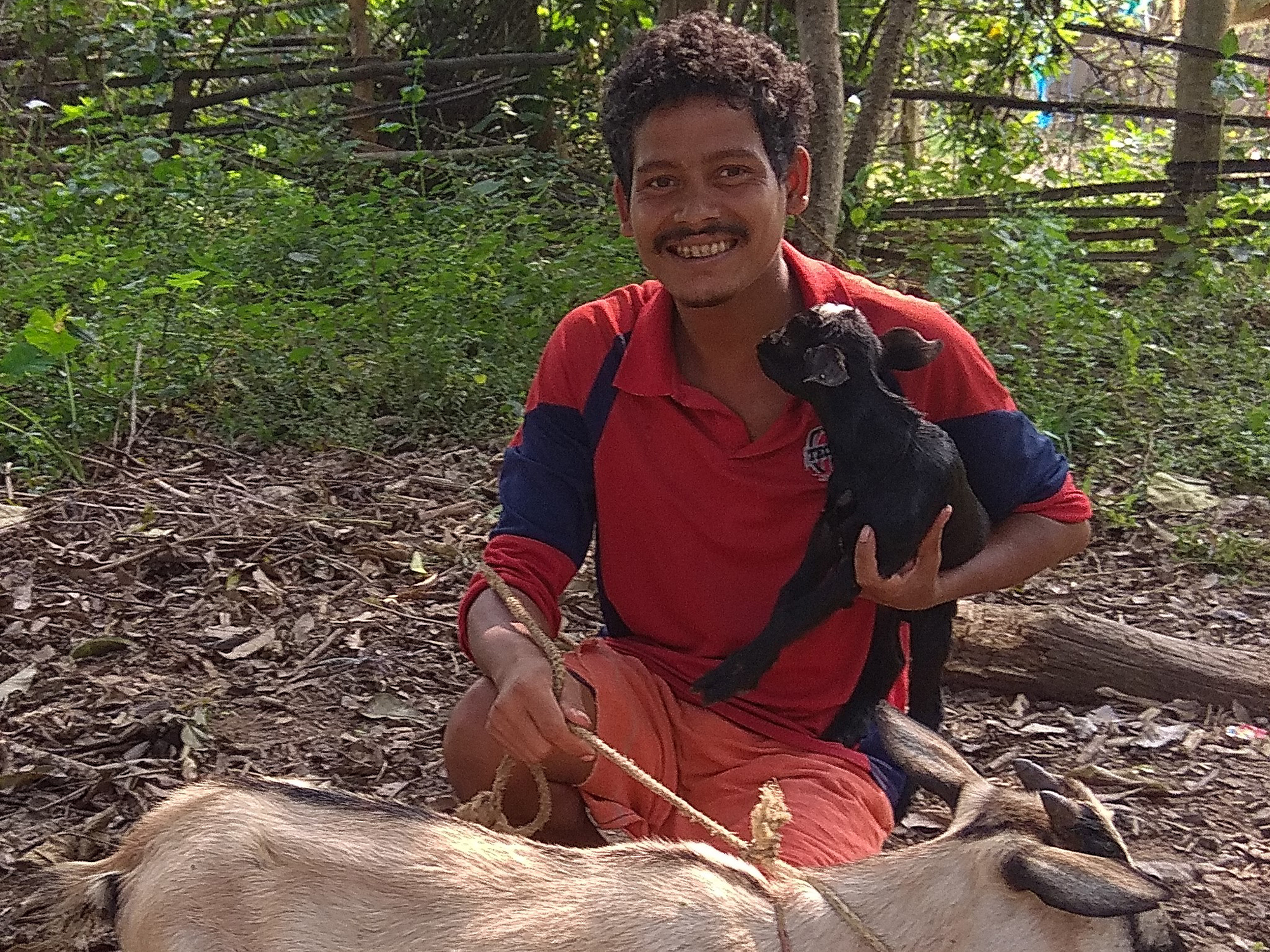 Sama Saya with a goat.