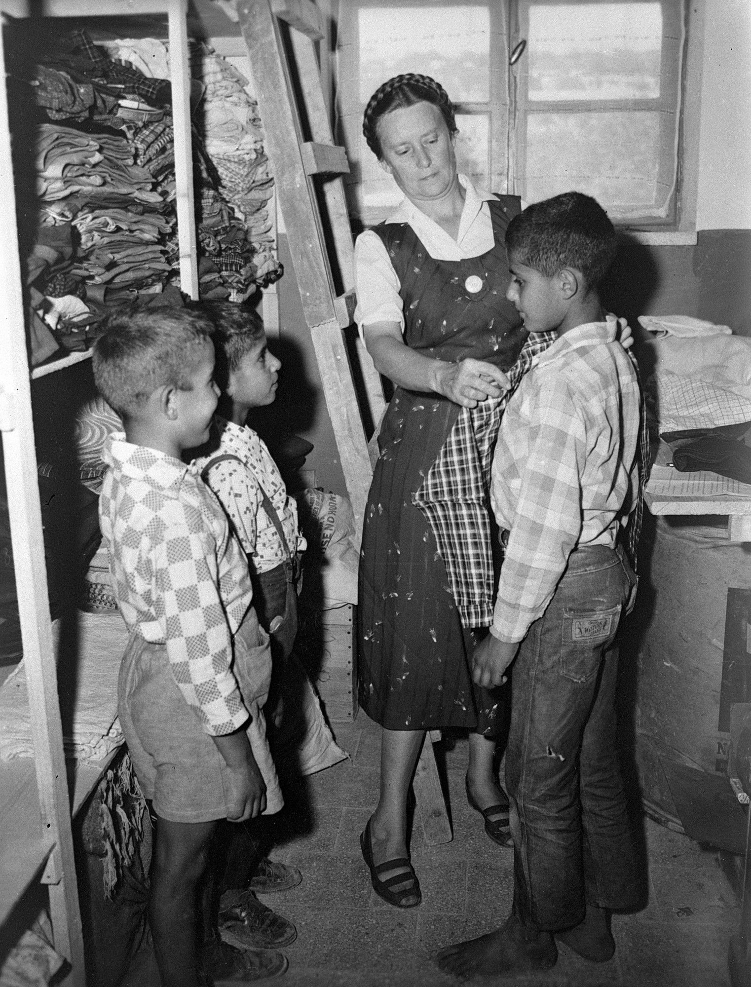 children receiving clothing
