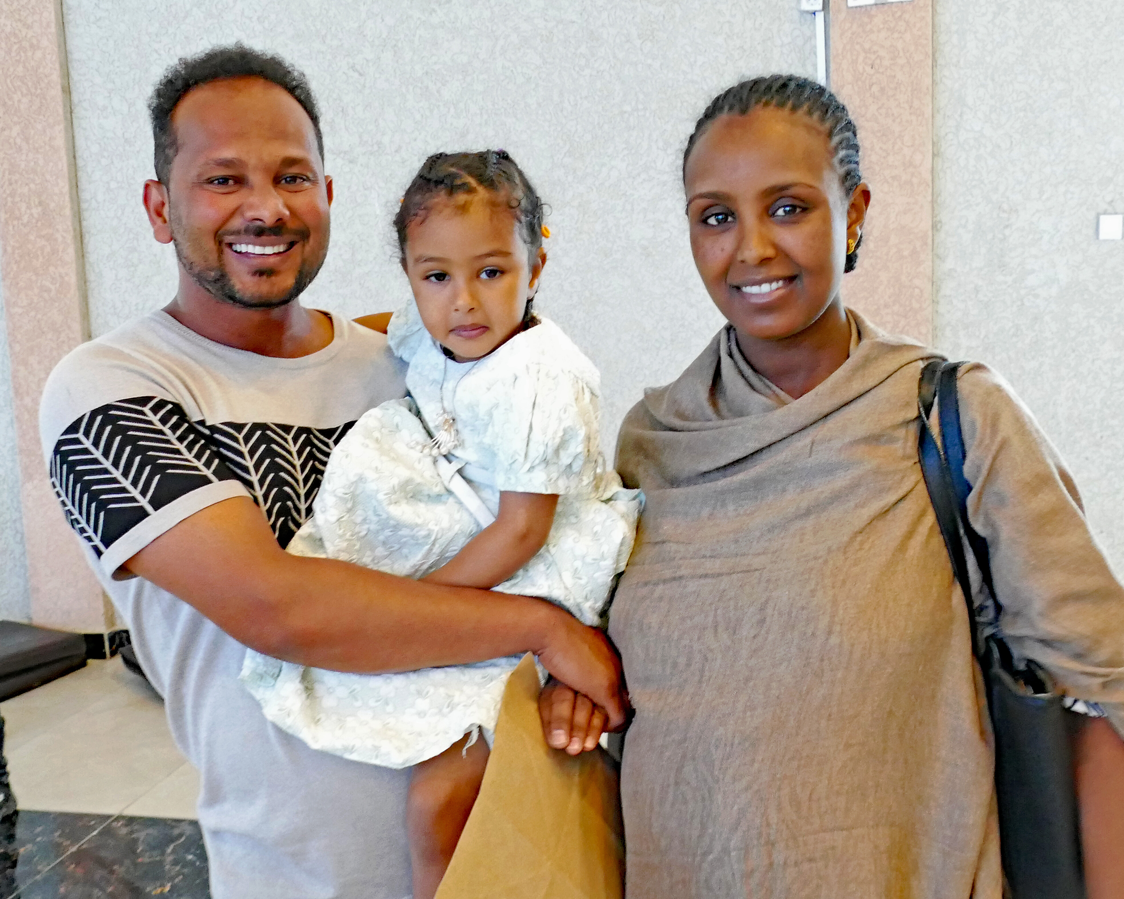 A happy family reunited after over 12 months apart! Bizuayehu Abera, holding daughter Medan and standing with his wife Senayt, was project manager of Tigray relief for Meserete Kristos Church in Ethiopia when the border was blockaded and he was stuck in Addis Ababa, away from his family in Tigray.