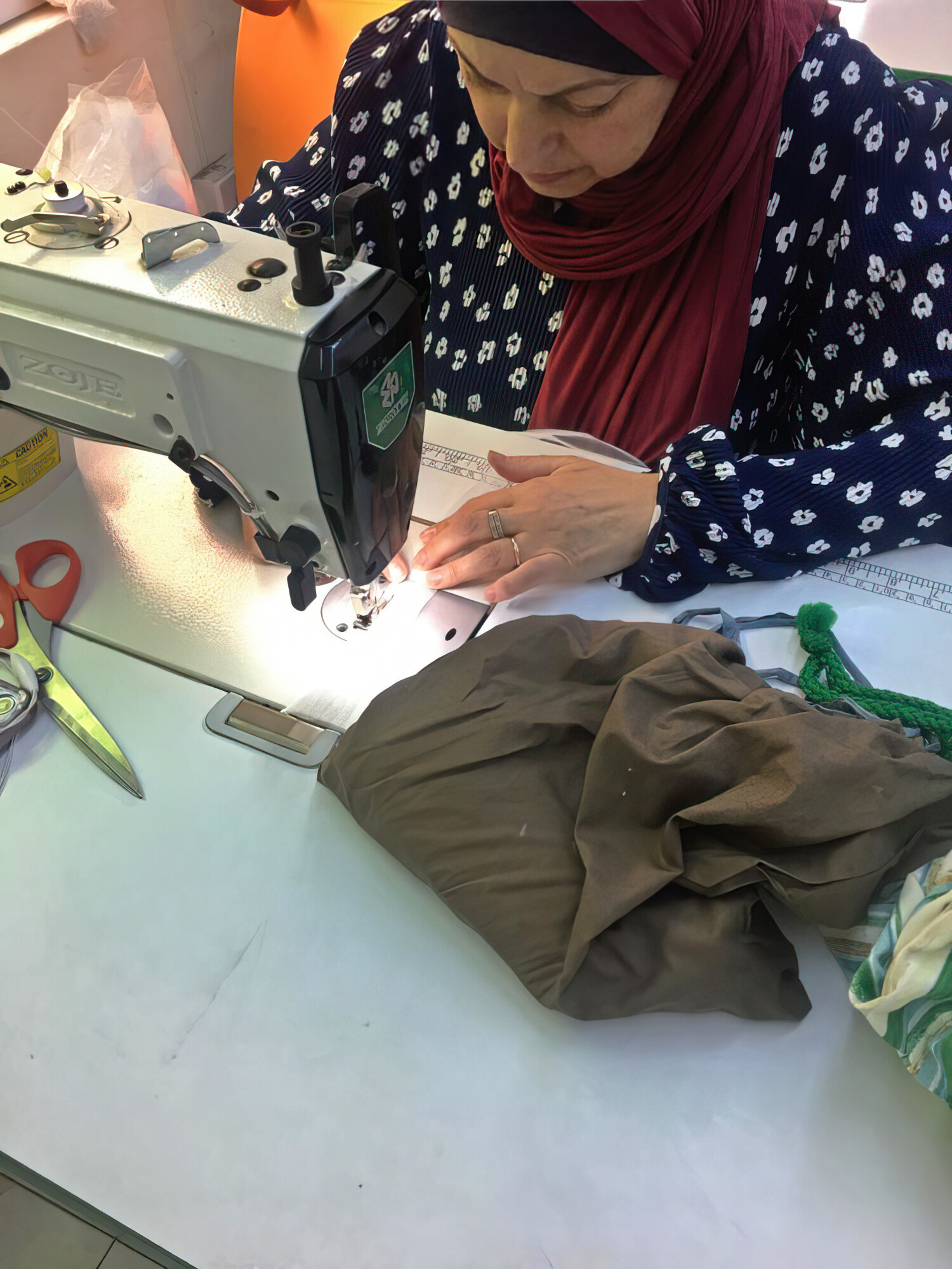 Lady using a sewing machine