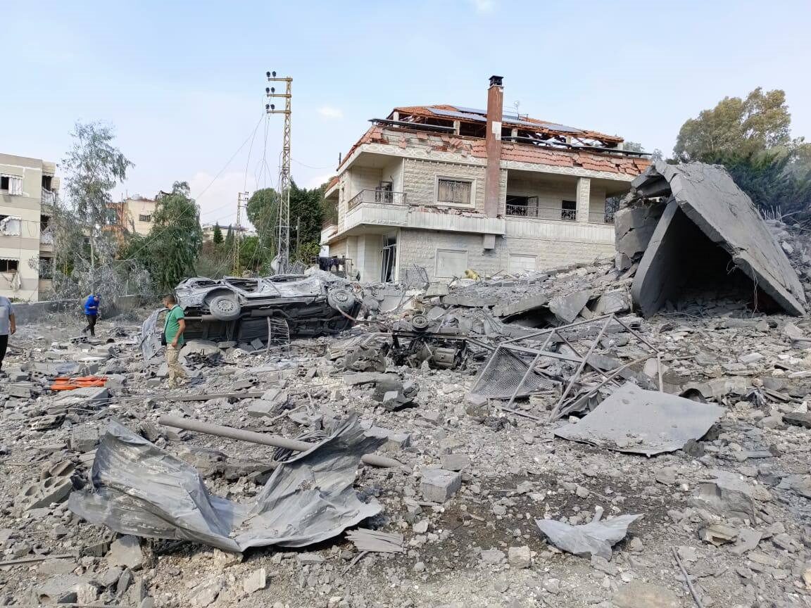 A destroyed home and street