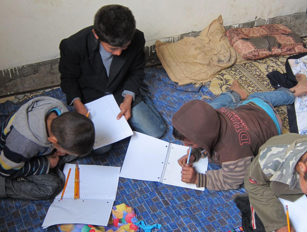 kids writing in notebooks