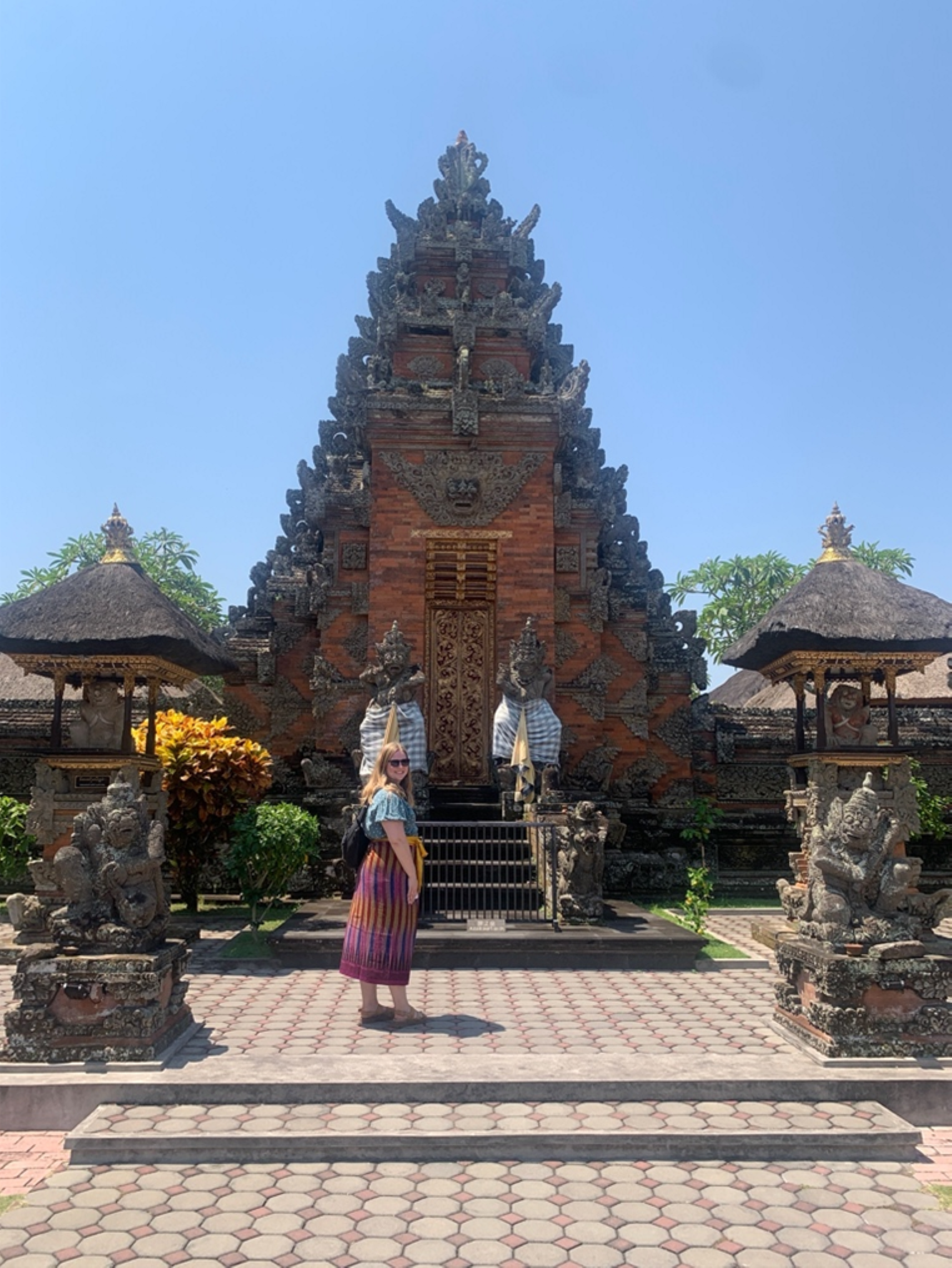 Kate Warkentin, a SALTer assigned to Nepal, stands in front of a temple