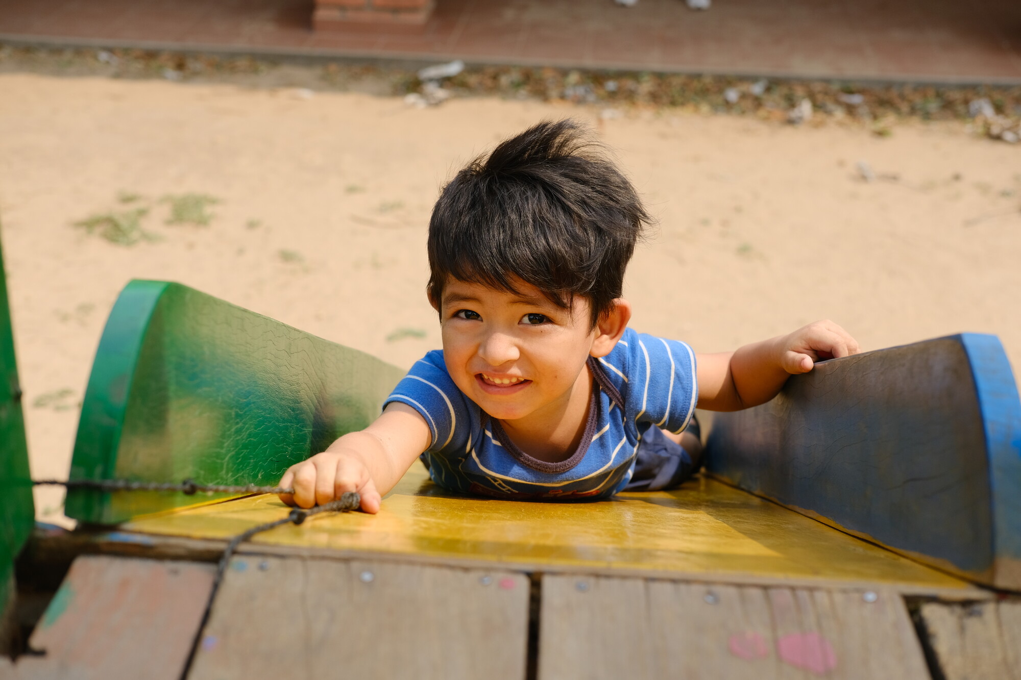 Three-year-old José Alejandro Medina Dorado enjoys the playground at Samuelito Daycare.