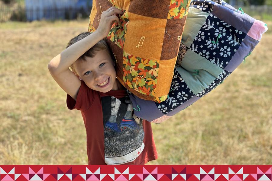 Boy holding a blanket