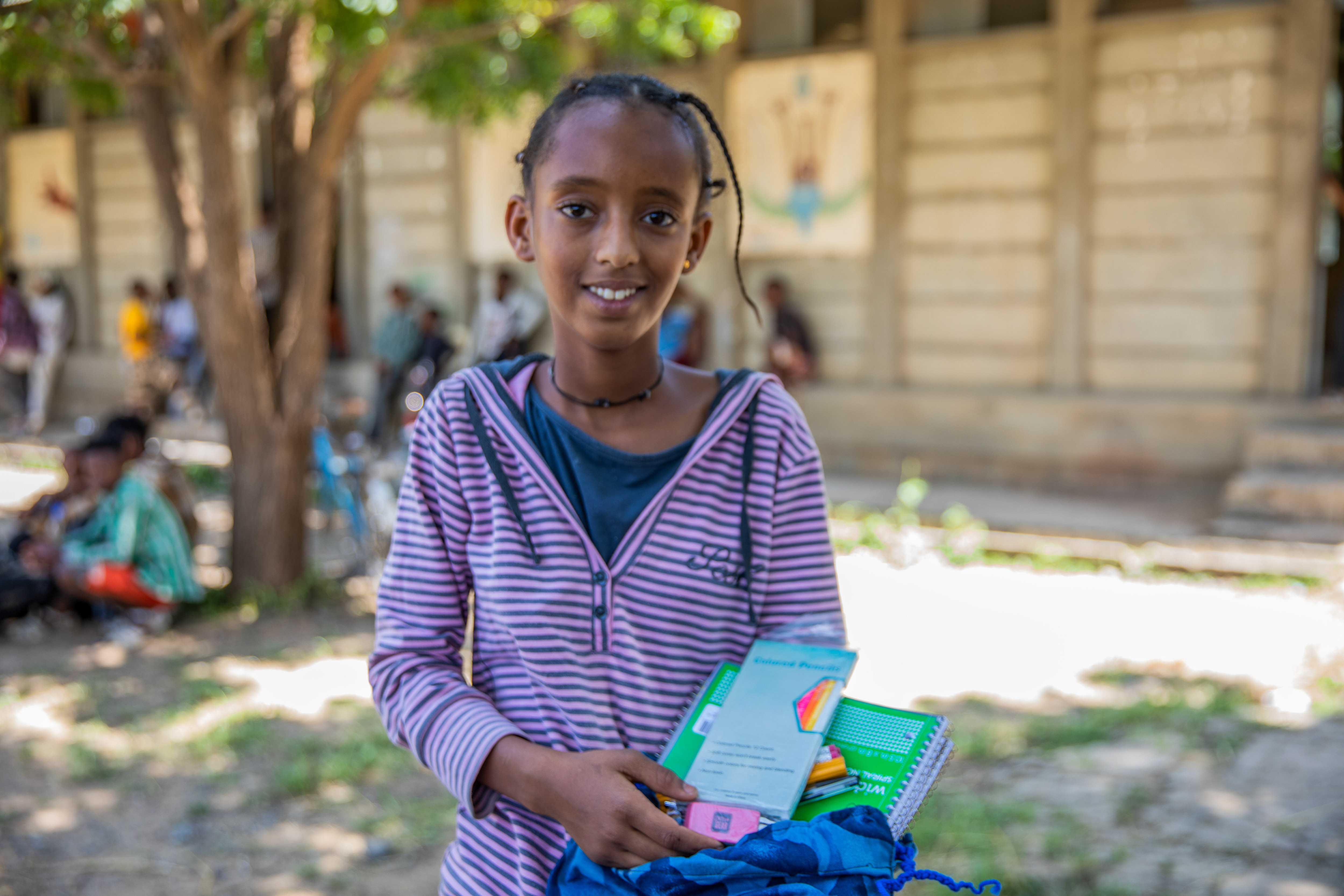 Kalkidan Fistum, 13, holds the MCC school kit supplies she will use at Enda Ferensay Elementary School during the 2024–2025 school year. The kit was given to her during a distribution at Rama Secondary School, Tigray region , on September 19, 2024.