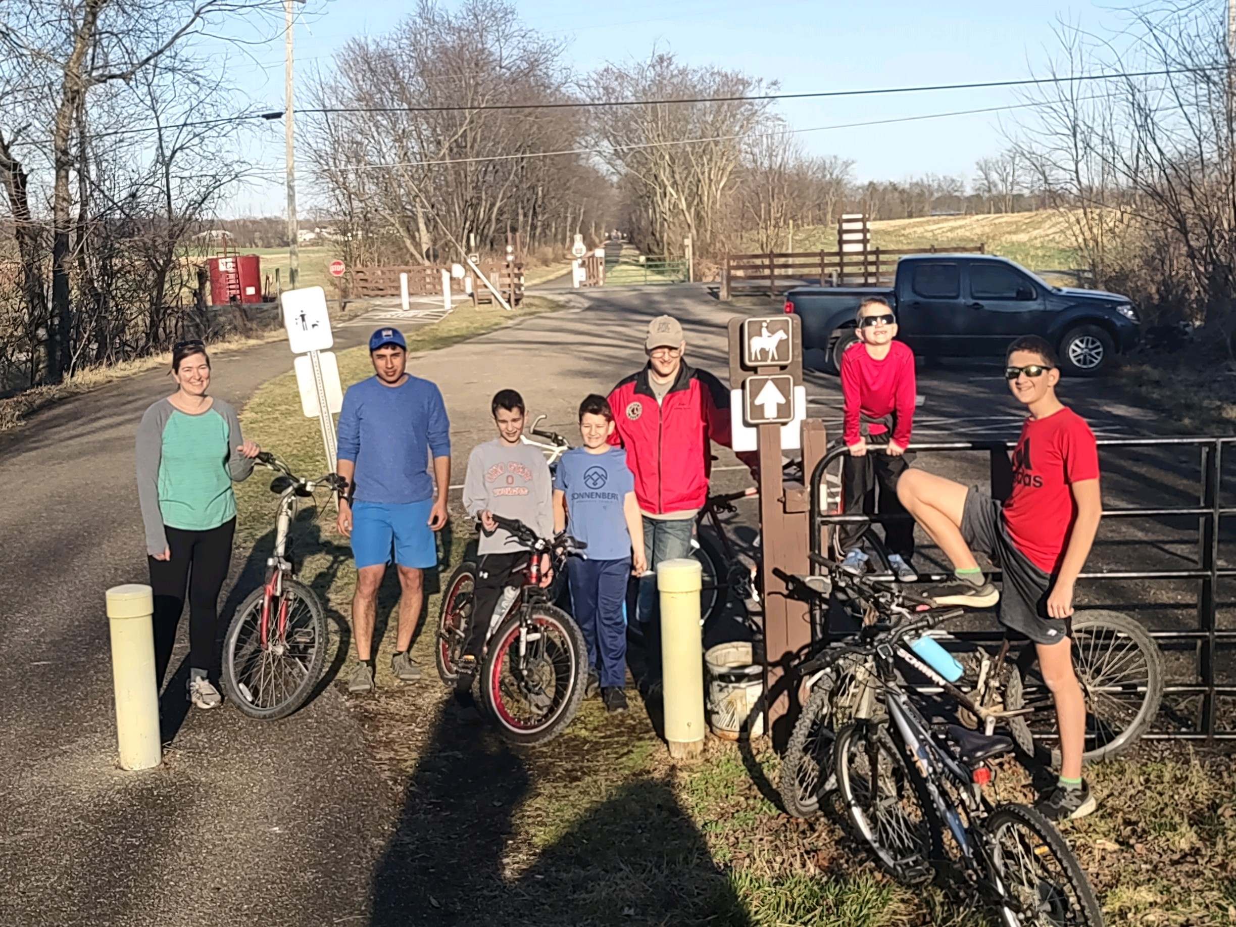 group of people standing with bicycles