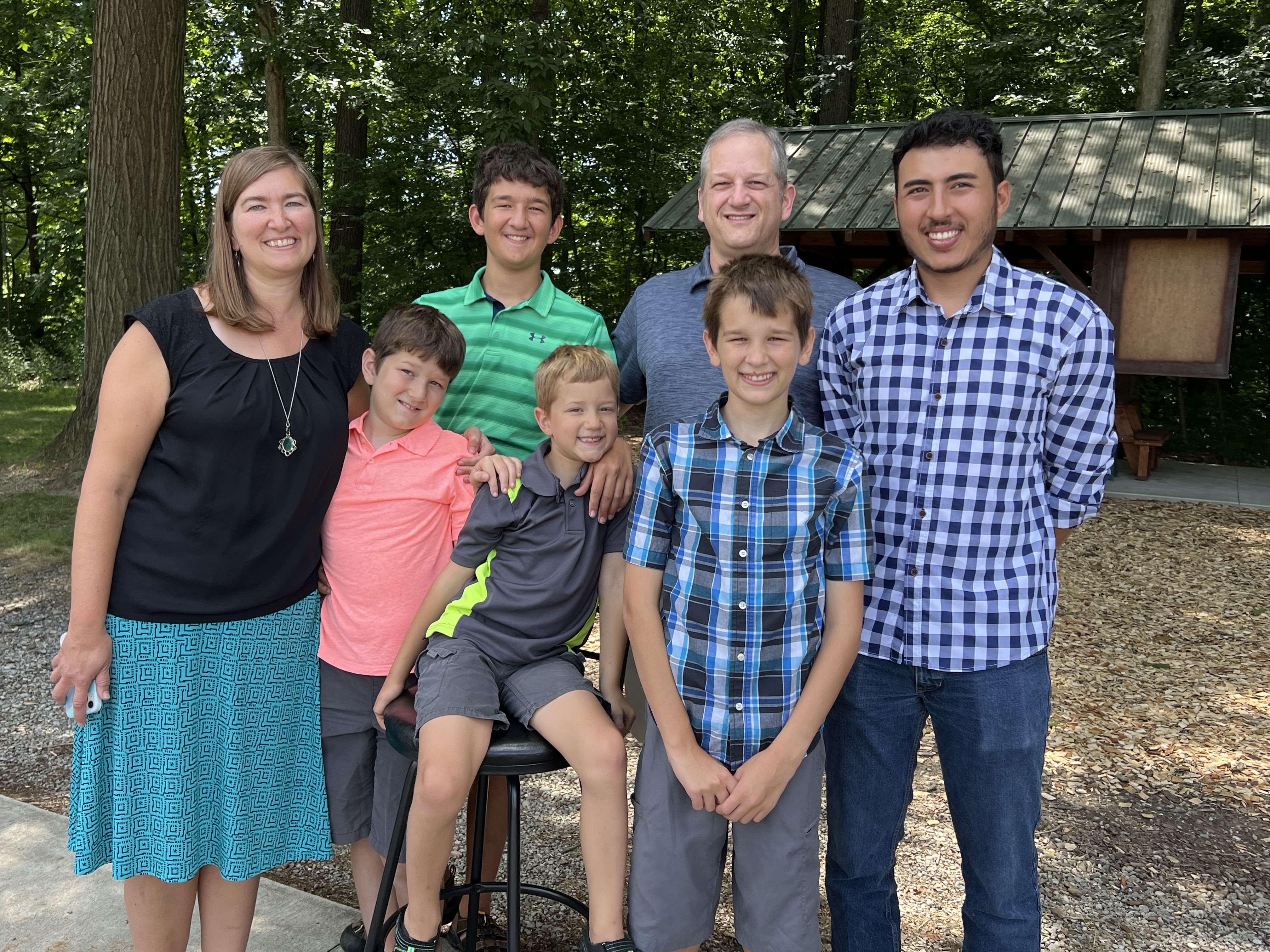 group of people pose for a photo and smile at camera