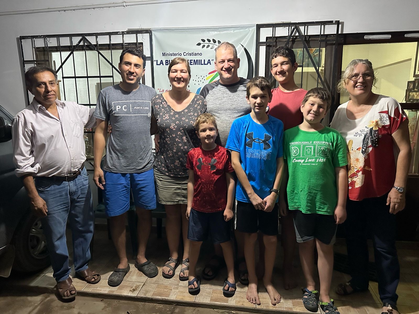 Group of people standing and smiling at camera