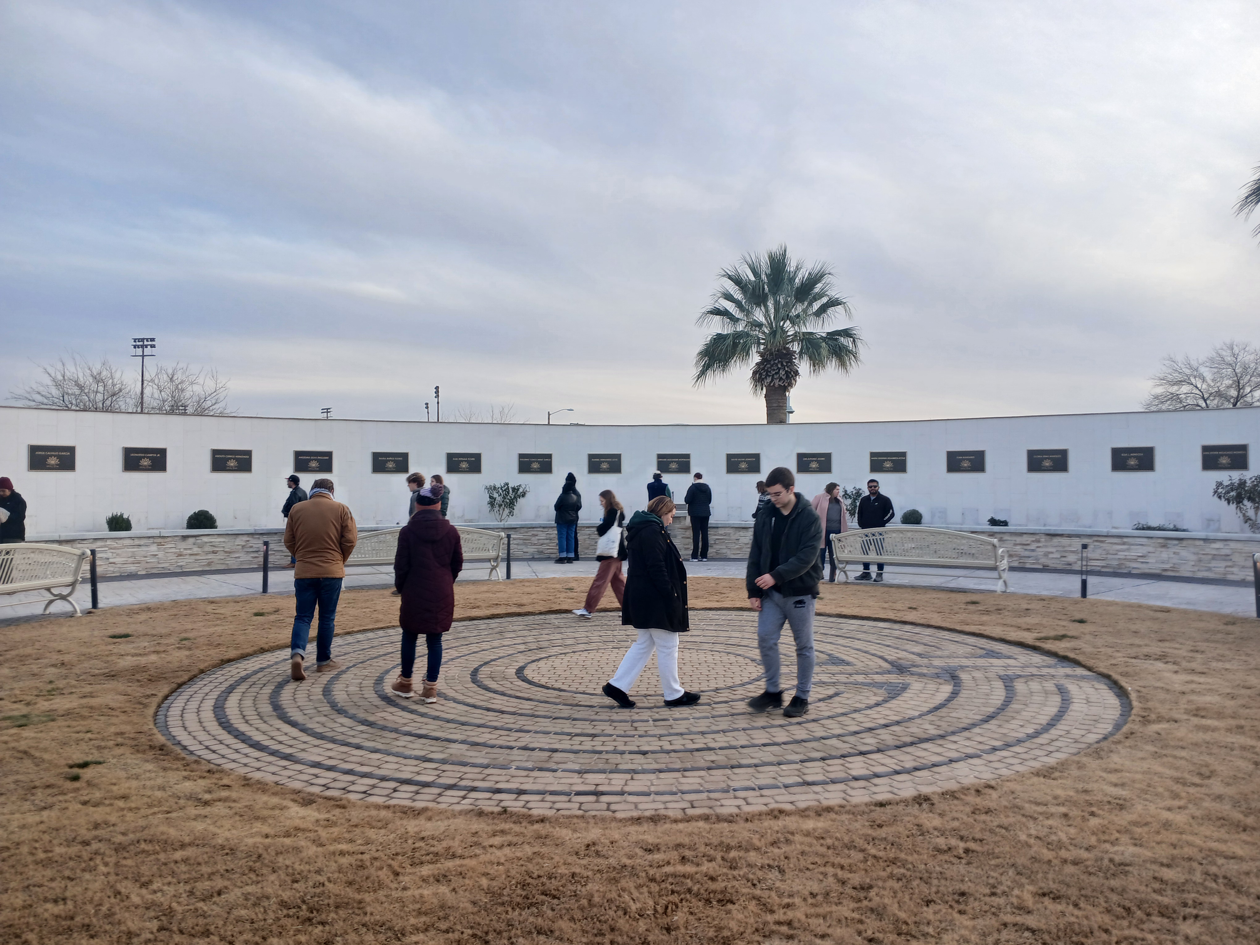 Young adults walk a prayer labyrinth