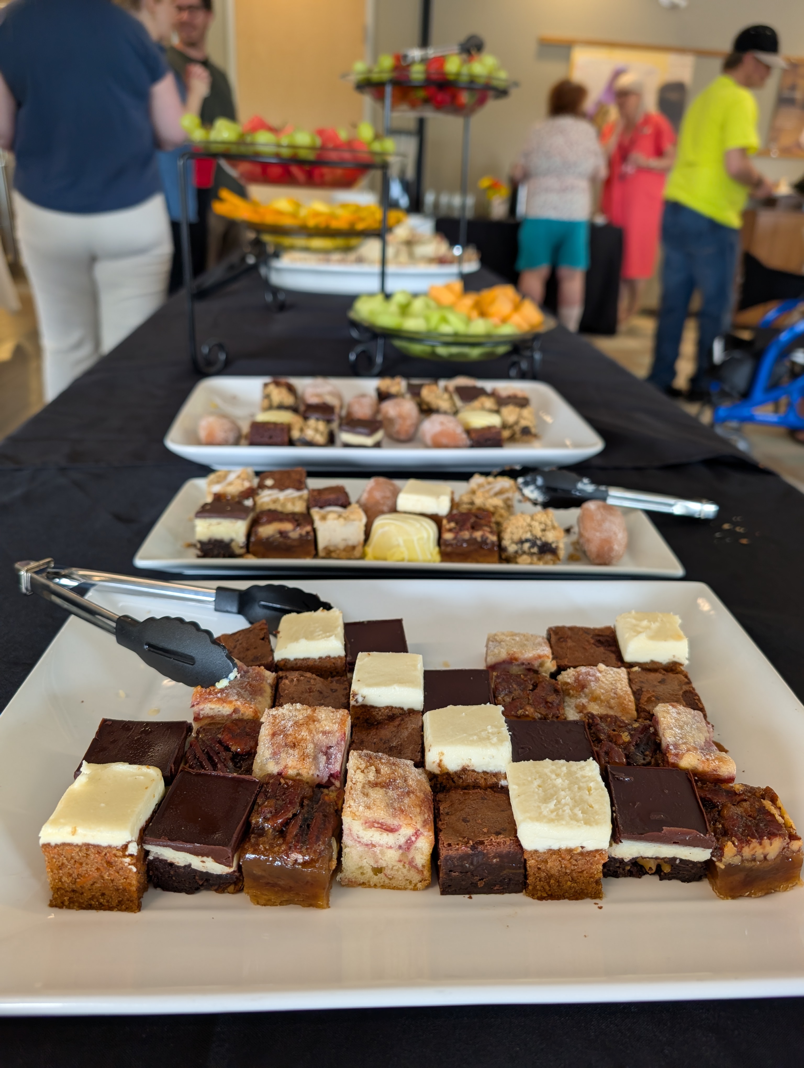 A long table full of treats and snacks.
