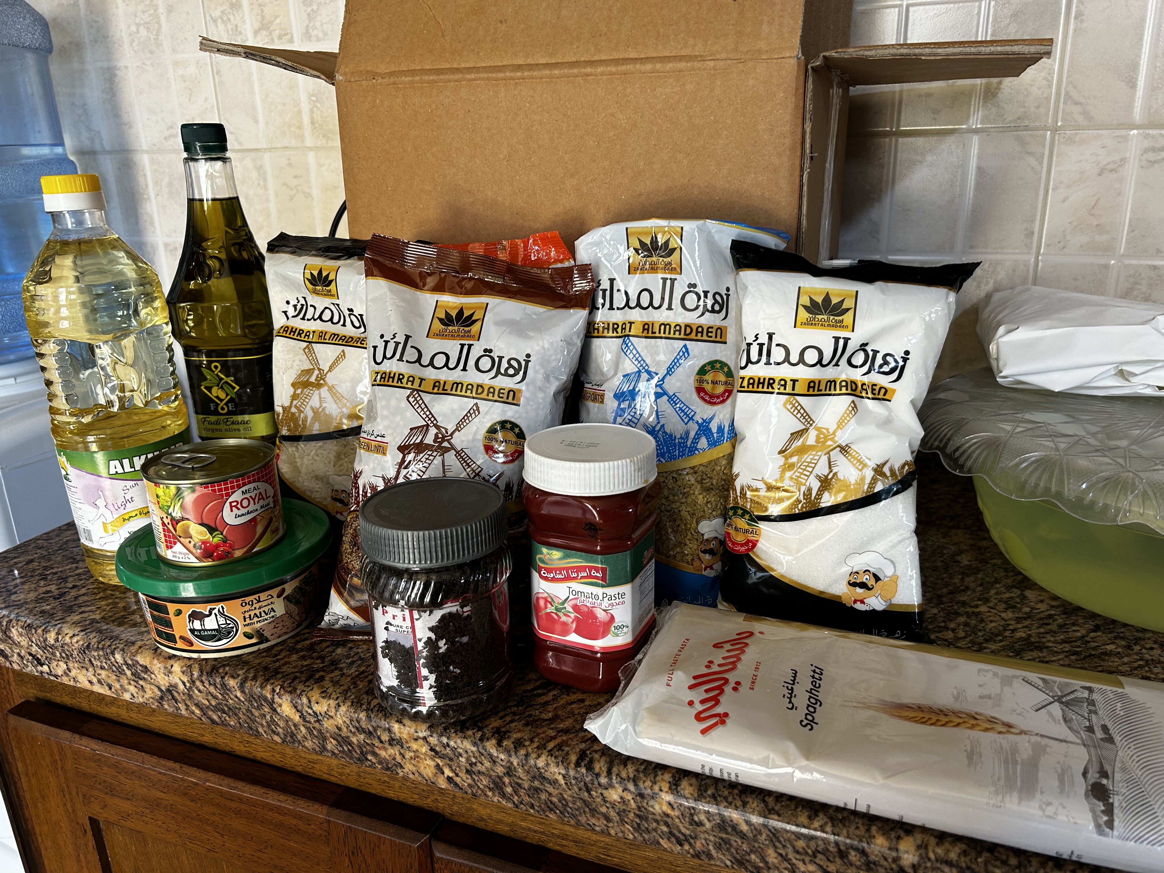 A selection of dried and canned goods that are distributed to food relief recipients