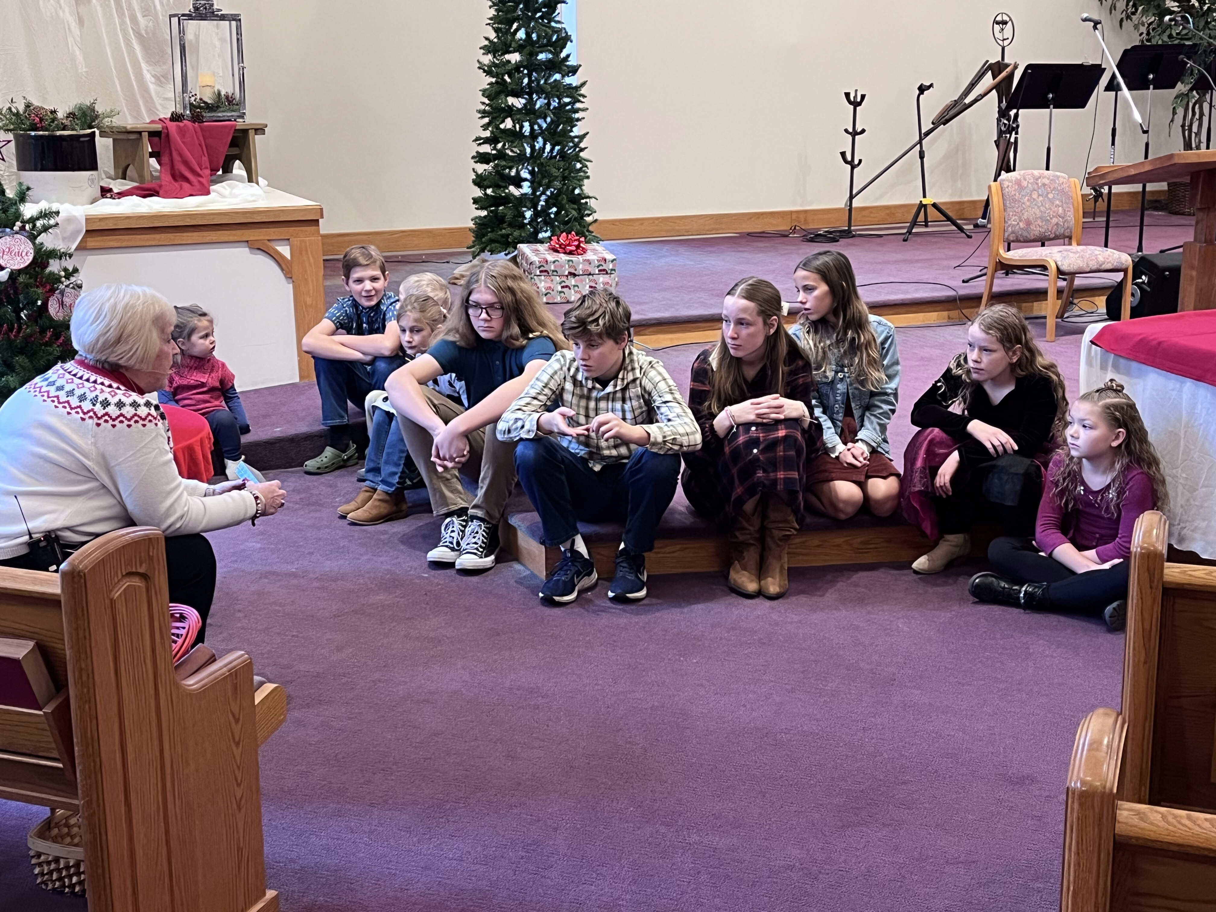 Youth gather at Toledo (Ohio) Mennonite Church for an Advent-season conversation. Over the course of December 2024, the youth explored how acts of service could be meaningful forms of giving, and something that anyone, of any age, could do.